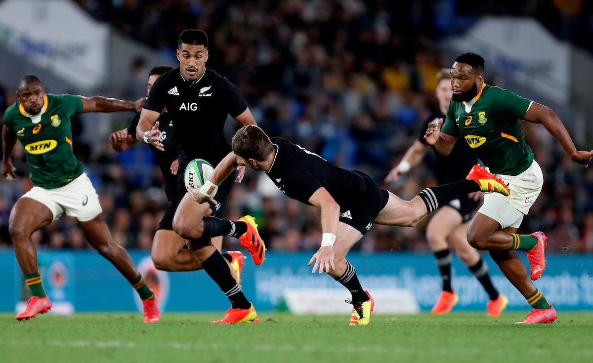 Jordie Barrett offloads to Rieko Loane in a test against South Africa in 2021. Photo / Photosport