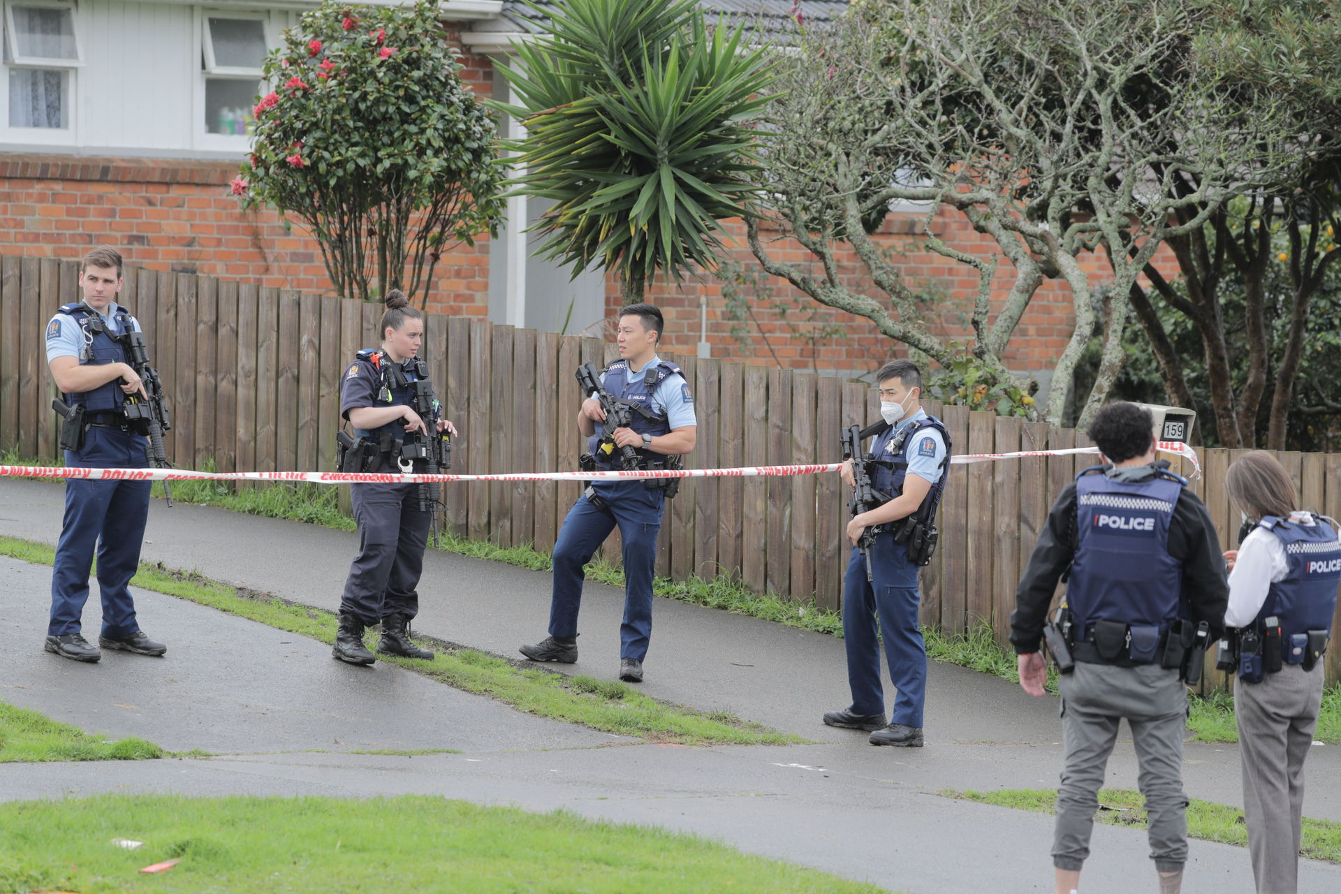 Armed police guard a property in Glen Innes the day after a July 19, 2022 shooting. Photo / Michael Craig