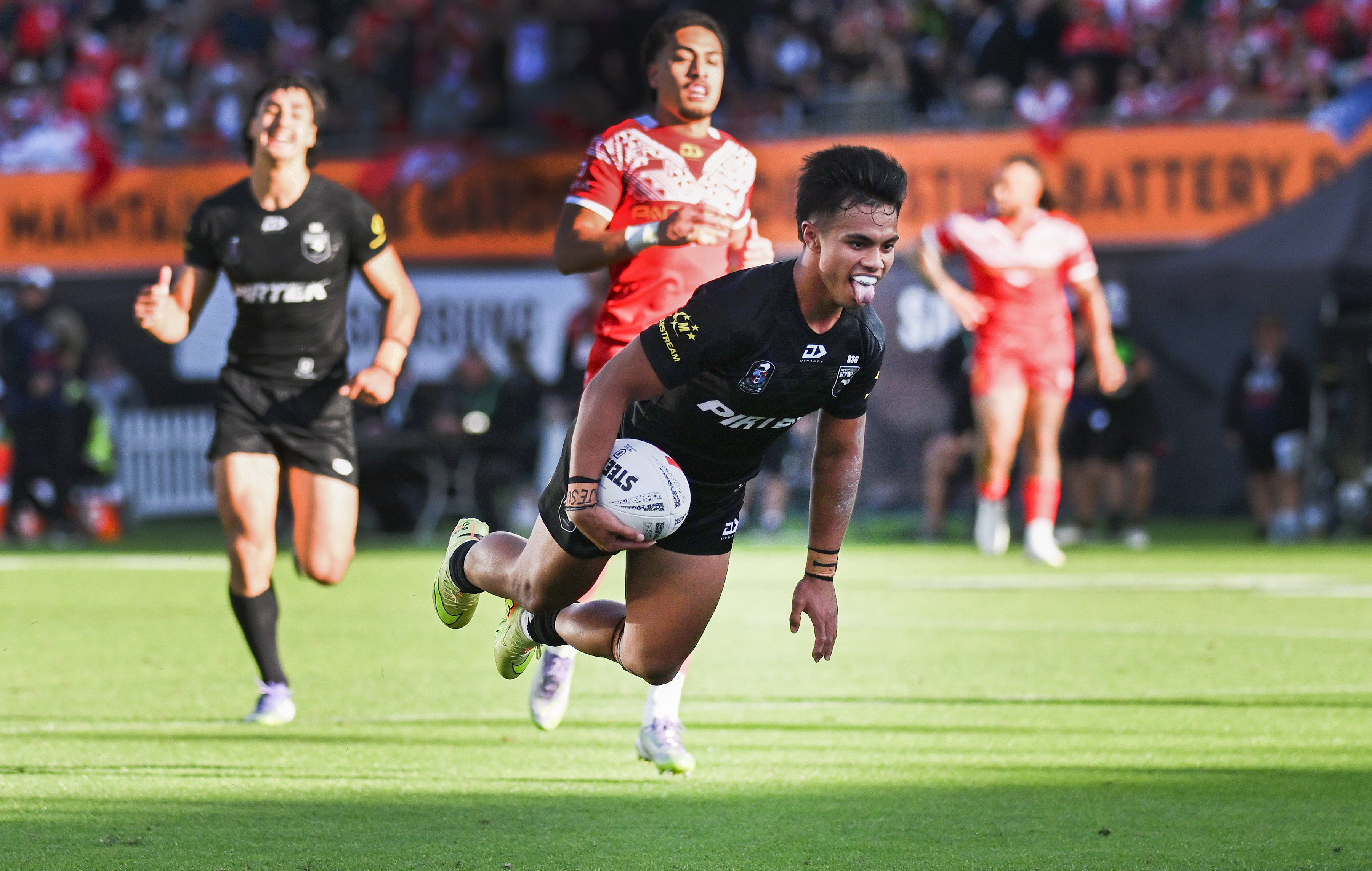 Keano Kini dives over for his try against Tonga. Photo / Photosport.