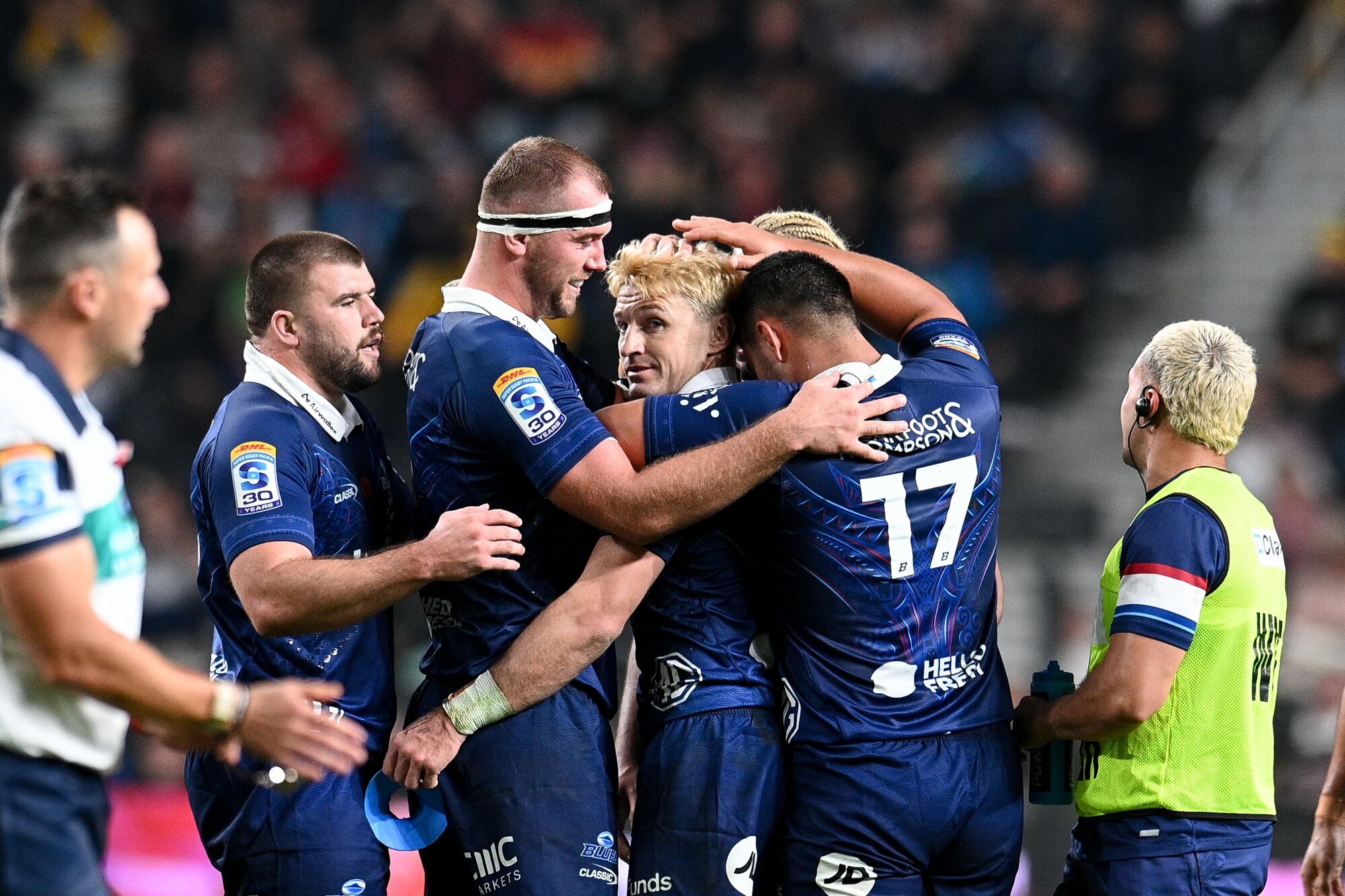 Blues players celebrate after Beauden Barrett's match-winning penalty against the Reds in Christchurch. Photo / Photosport