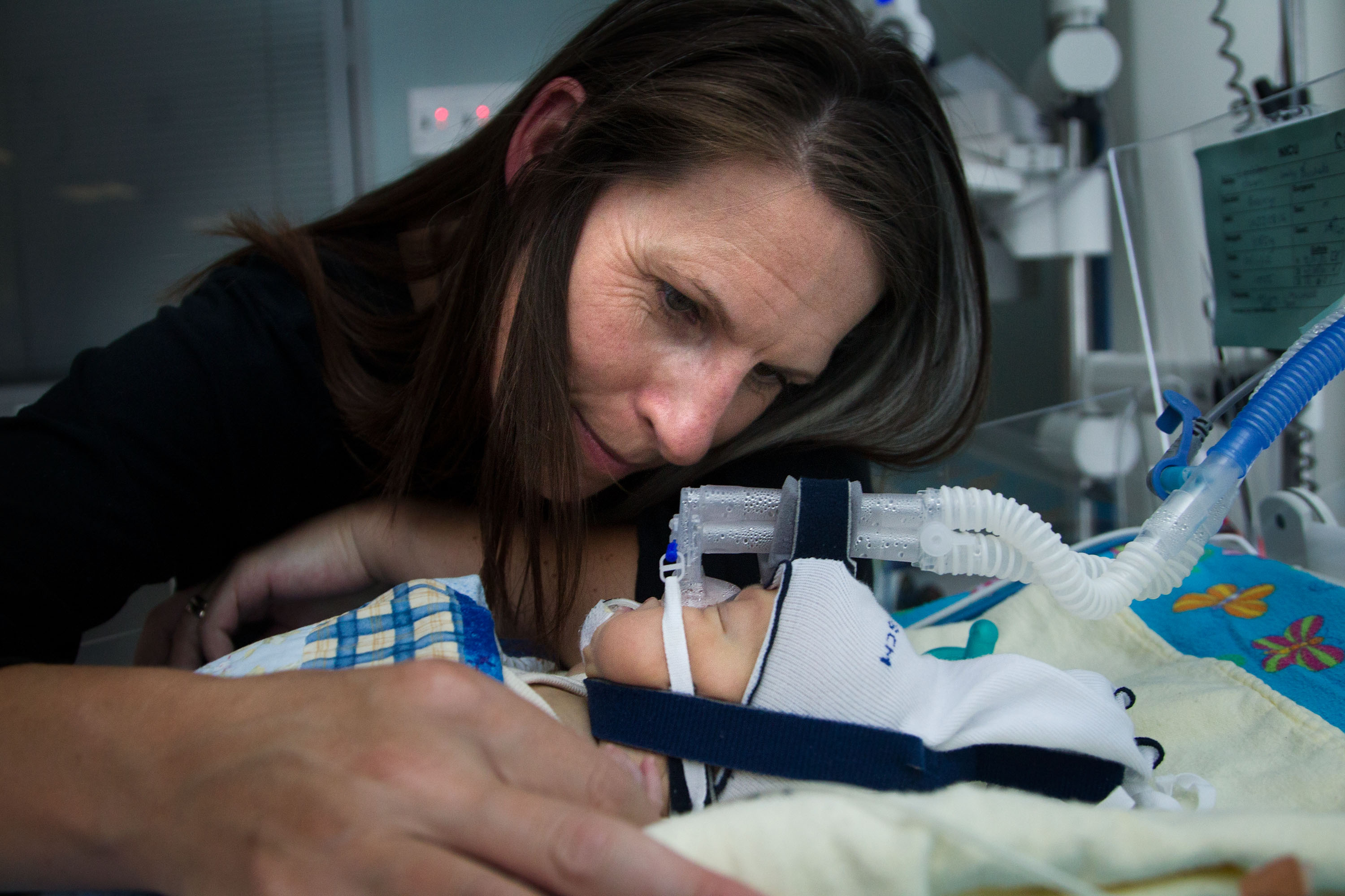Michelle Bain with her 9-week-old, Lachlan, in Wellington Hospital's neonatal intensive care unit yesterday. He has been in the unit since being born 16 weeks premature. Photo / Marty Melville