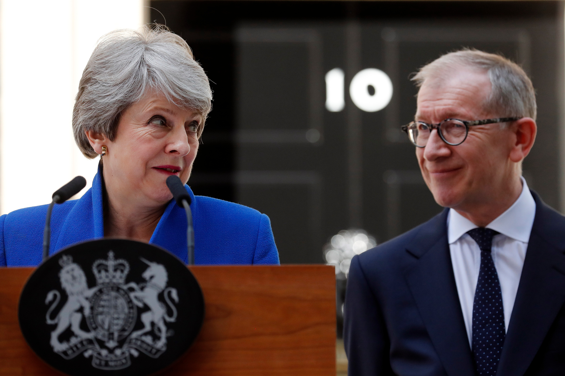 Britain's former Prime Minister Theresa May speaks outside 10 Downing St with her husband Philip. Photo / AP