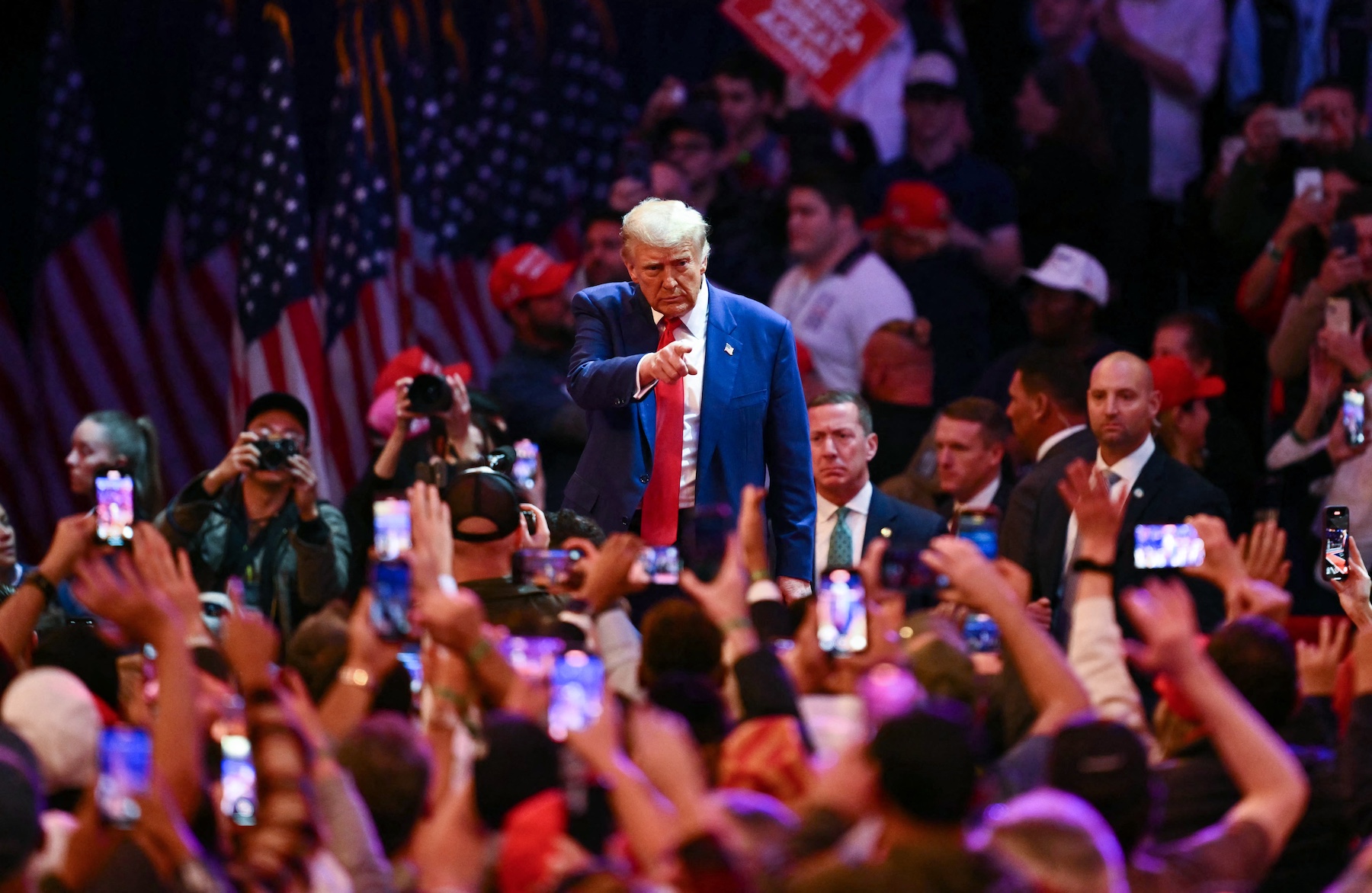 Former US President and Republican presidential candidate Donald Trump leaves a campaign rally. Photo / AFP
