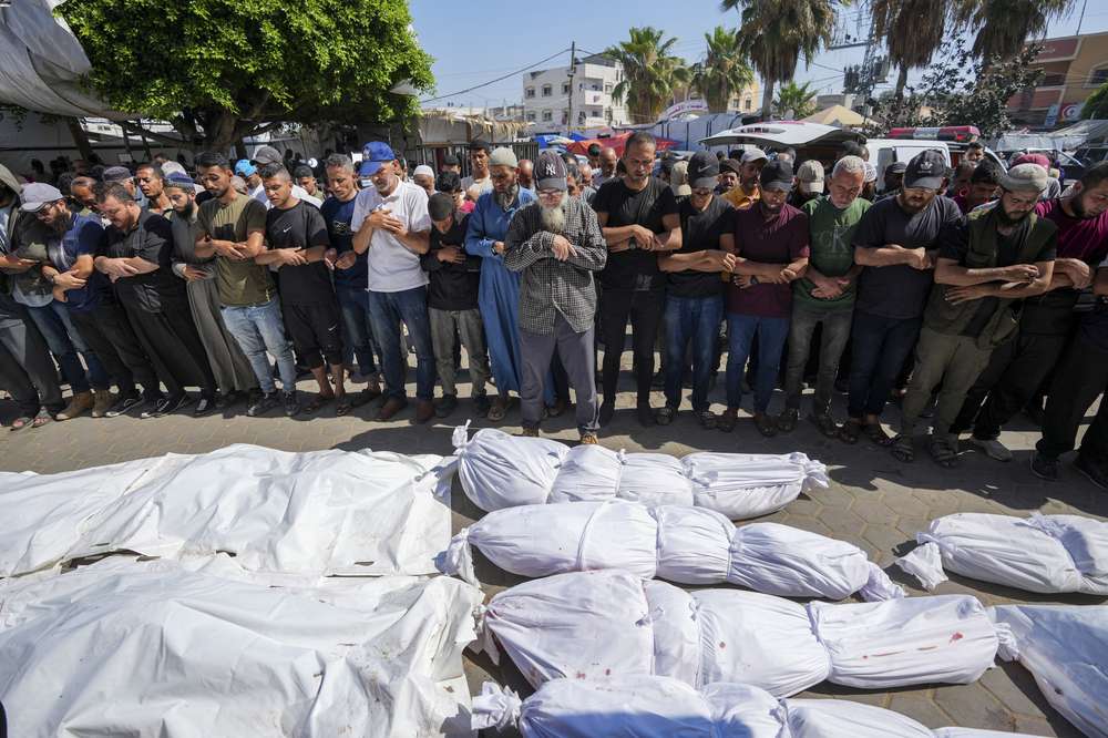 Palestinians mourn relatives killed in an Israeli strike on a UN-run school in the Nusseirat refugee camp, outside a hospital in Deir al Balah, Gaza Strip. The Israeli military said that Hamas militants were operating from within the school. Photo / AP