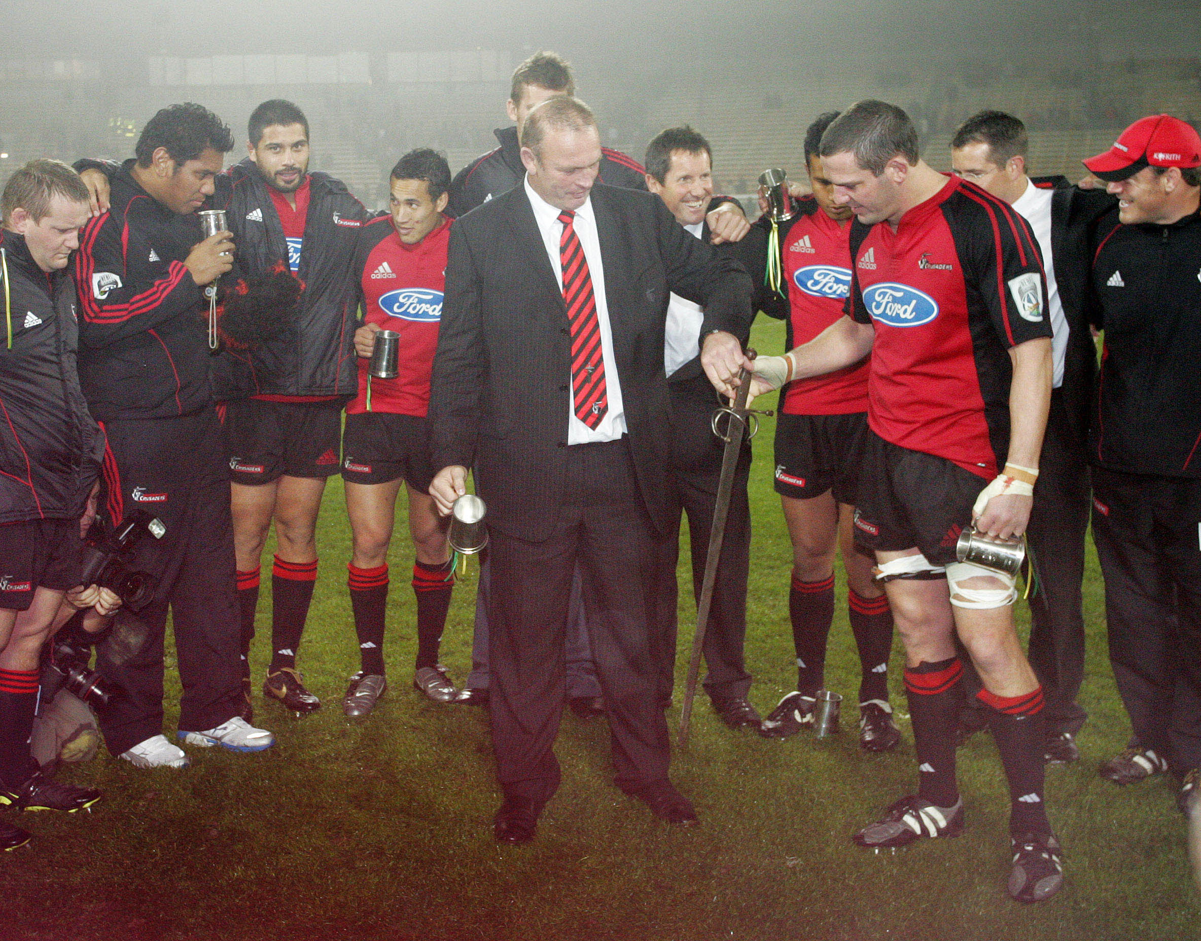 Vern Cotter as Crusaders assistant coach with Reuben Thorne celebrates with the Crusader sword after winning the Super 14 Final between the Crusaders and the Hurricanes at Jade Stadium in 2006. Photo / Photosport
