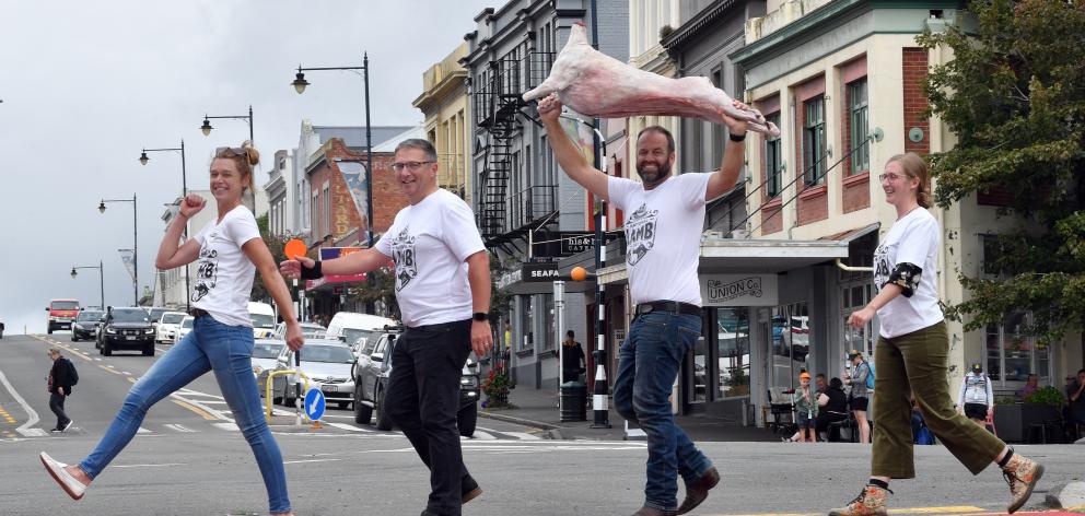Getting in step for National Lamb Day are (from left) Maniototo farmer Emma Crutchley, Port Otago commercial manager Craig Usher, Southland farmer Jon Pemberton and Totara Estate property lead Jacqui Allison. Photo / Stephen Jaquiery