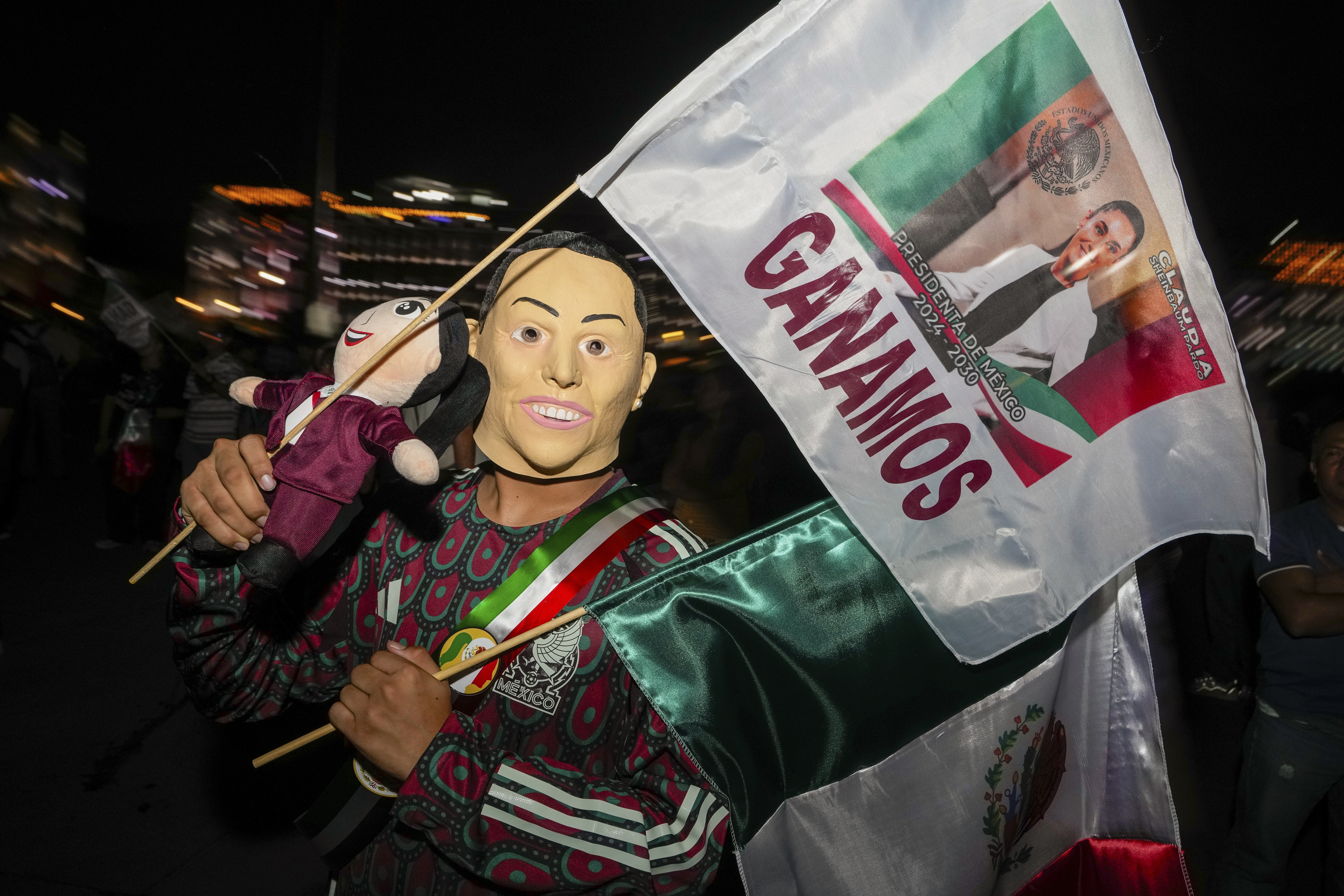 A supporter of ruling party presidential candidate Claudia Sheinbaum holds a flag that reads in Spanish 'we won'.  Photo / AP