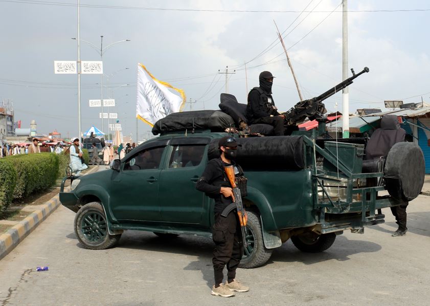 Taliban fighters stand guard at the site of an explosion that ripped through a hotel in the city of Khost province, eastern Afghanistan. Photo / AP