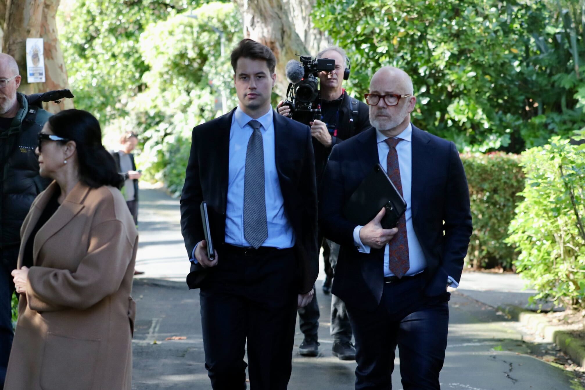 Philip Polkinghorne's defence team, led by Ron Mansfield KC (right) with Harrison Smith, at the home in Upland Rd, Remuera. Photo / Jason Dorday