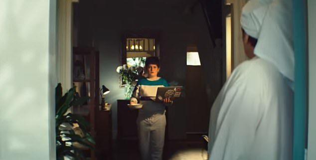 The teenage boy appears and looks horrified when seeing who is at the door, dropping his cereal bowl in disbelief.