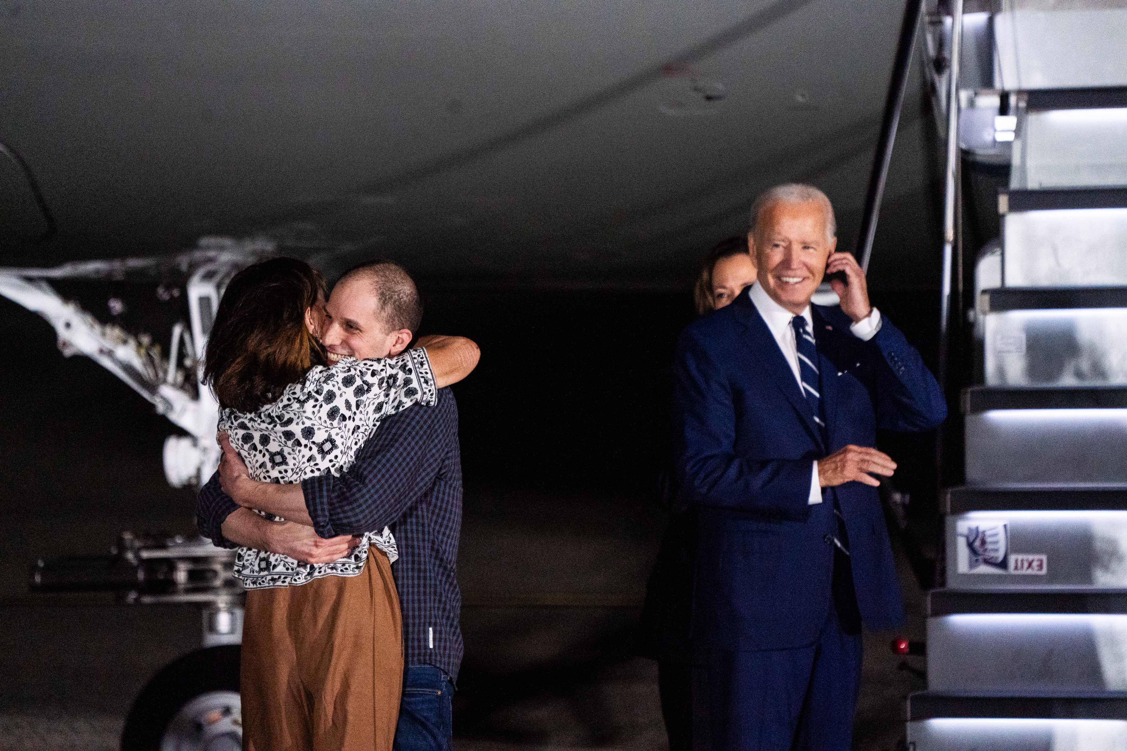 Evan Gershkovich hugs Ella Milman after returning to the United States from detention in Russia. President Biden and Vice President Harris met the released hostages upon their return at Joint Base Andrews. Photo / The Washington Post
