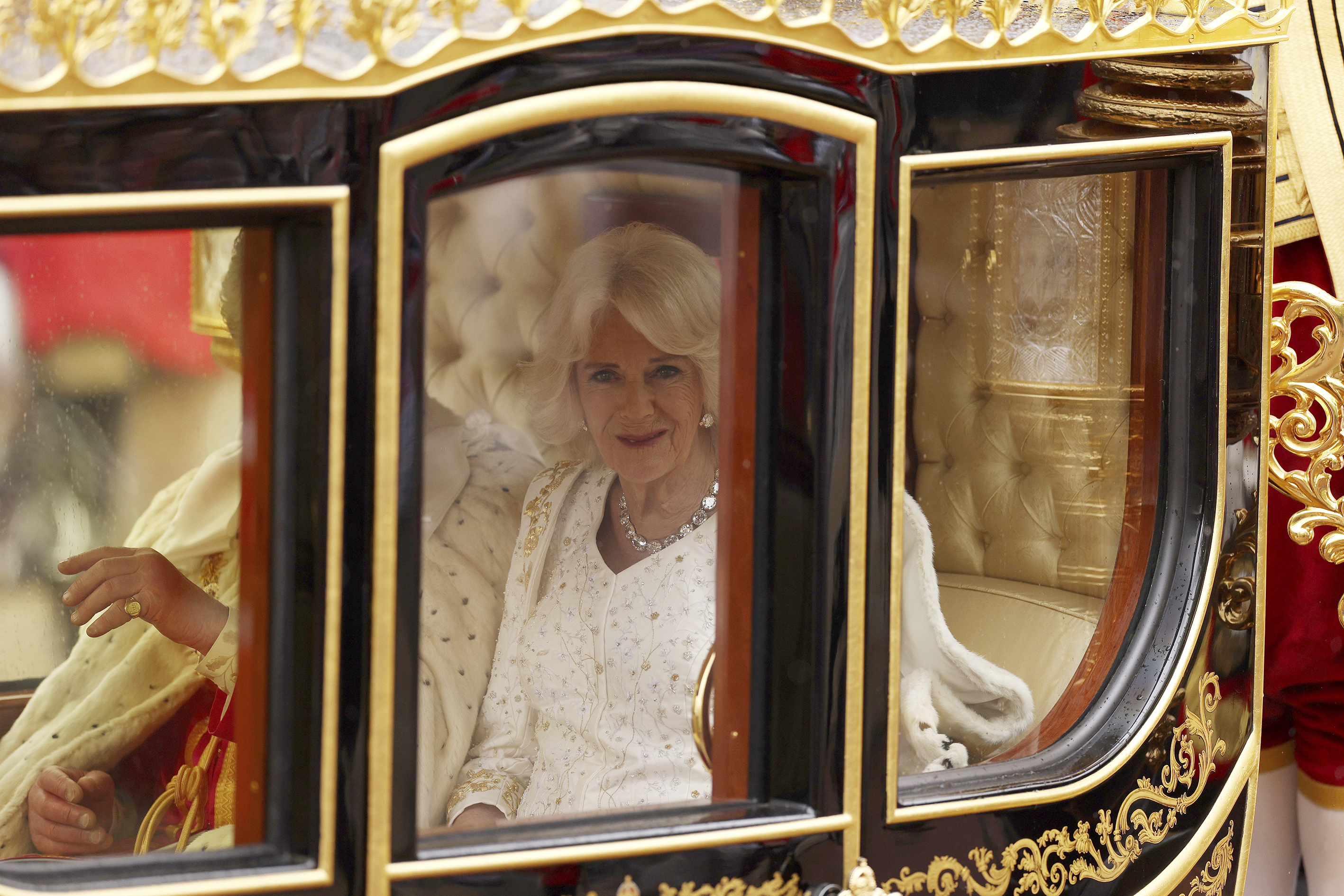 Camilla, the Queen Consort, travels in the Diamond Jubilee Coach to Westminster Abbey. Photo / AP