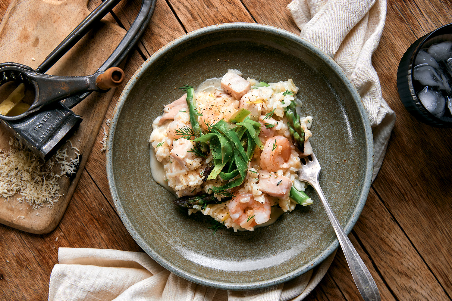 This lush seafood risotto is topped with fresh dill and a touch of parmesan. Photo / Babiche Martens