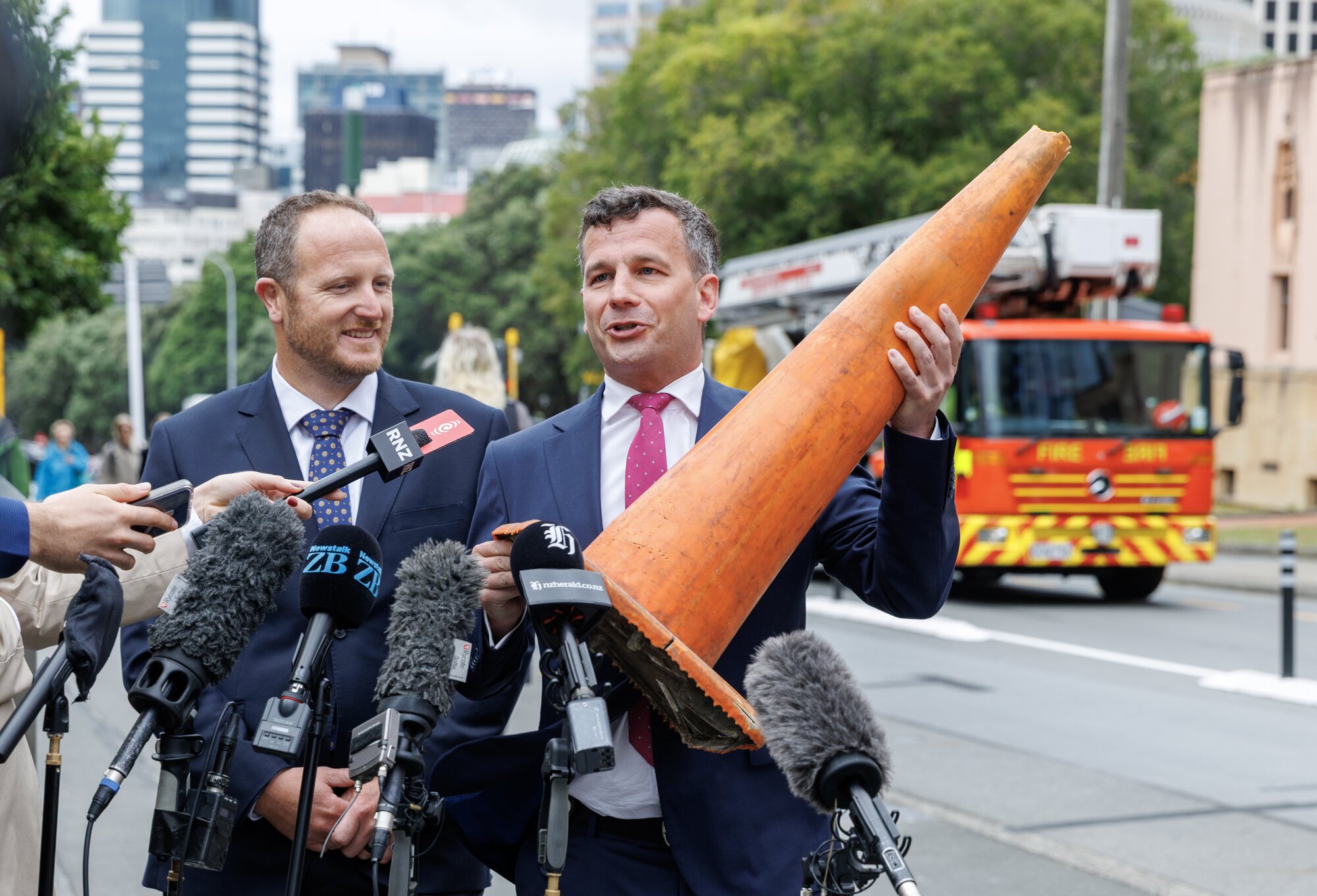 Act leader David Seymour holds aloft a road cone during his media stand-up with MP Cameron Luxton in Wellington. Photo / Mark Mitchell