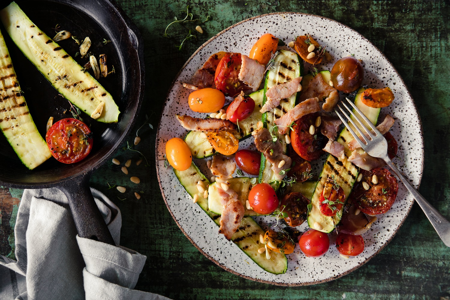 Warm tomato, courgette and bacon salad. Photo / Babiche Martens