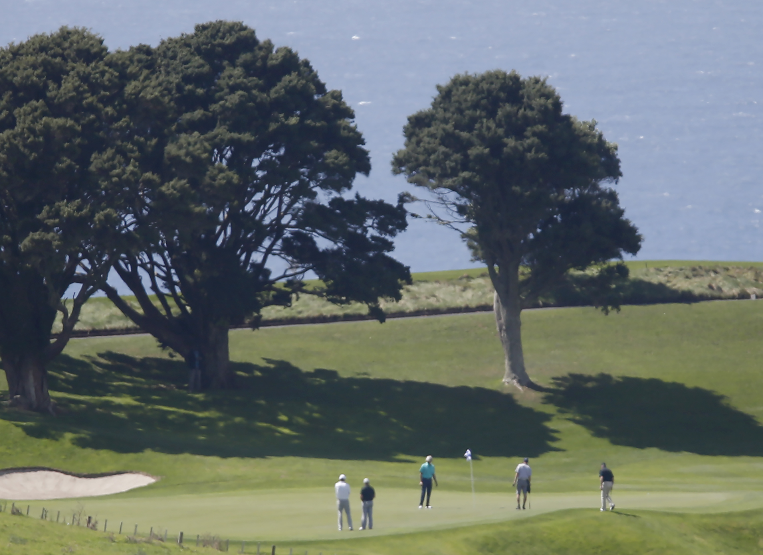 President Barack Obama and former Prime Minister Sir John Key during a round of golf at Kauri Cliffs. Photo / Michael Cunningham