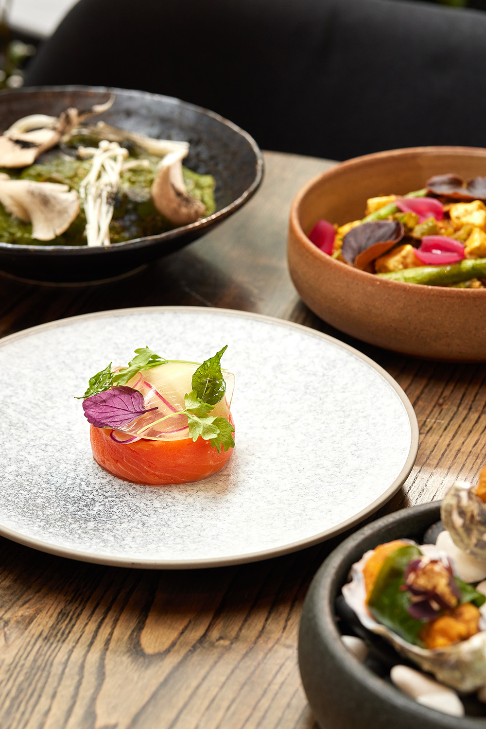 The cured salmon, vegetable stir fry and lamb seekh at Cassia on Federal St. Photo / Babiche Martens