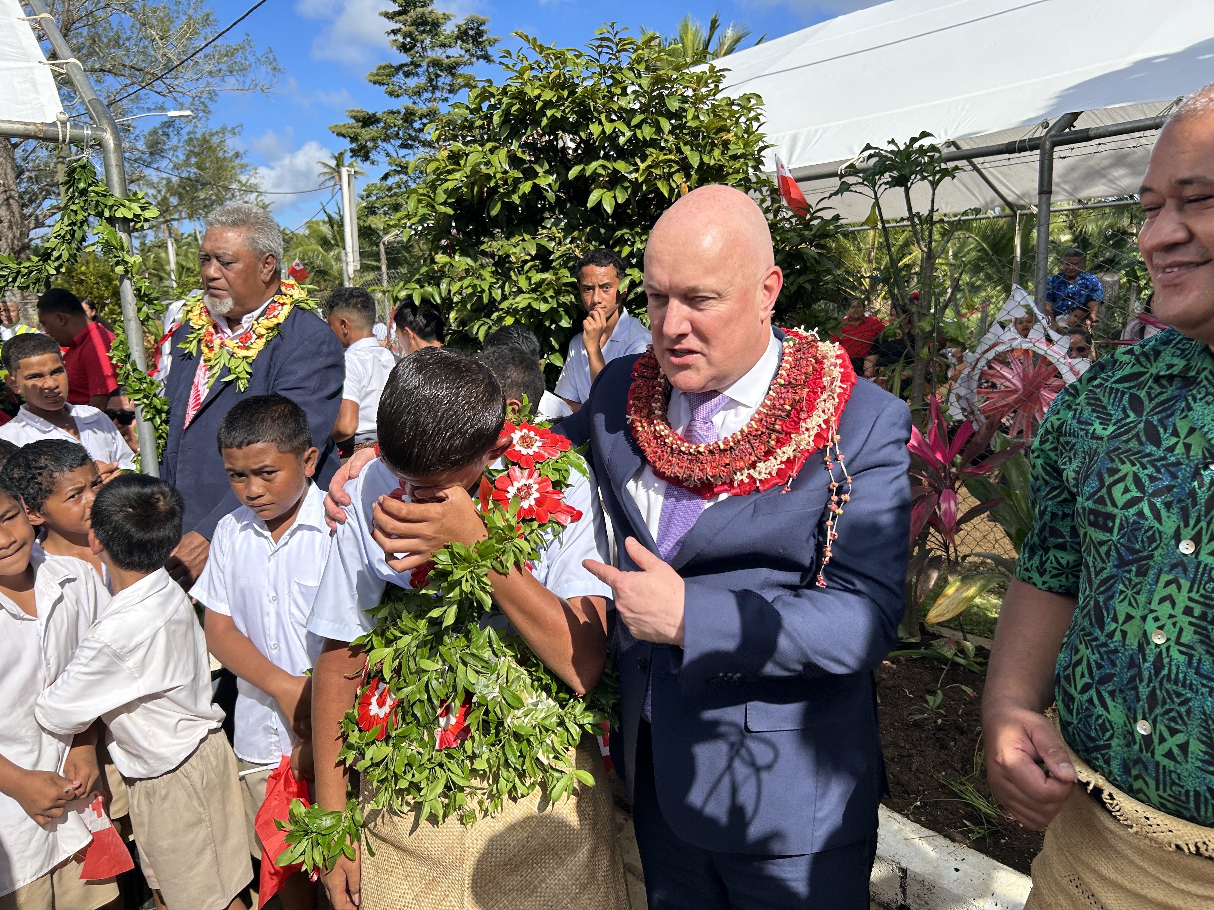 A deaf and non-verbal pupil of GMS Tokomololo School is overwhelmed by emotion as Prime Minister Christopher Luxon comforts him. Photo / Adam Pearse