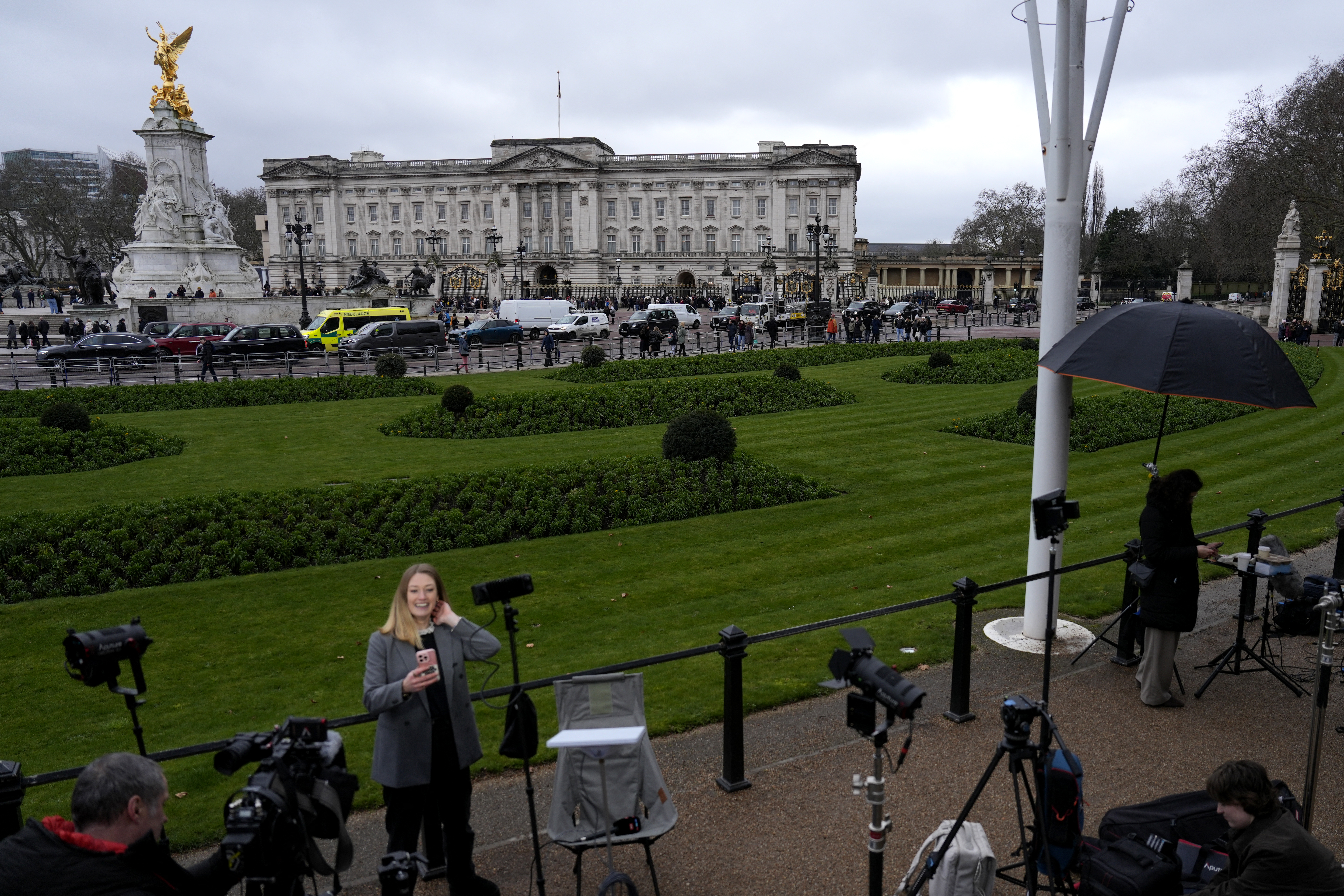 Members of the media gather outside Buckingham Palace in London for the arrest of former Prince Andrew. Photo / Carlos Jasso, AFP