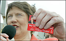 Prime Minister Helen Clark with Labour's pledge card. Picture / Martin Sykes