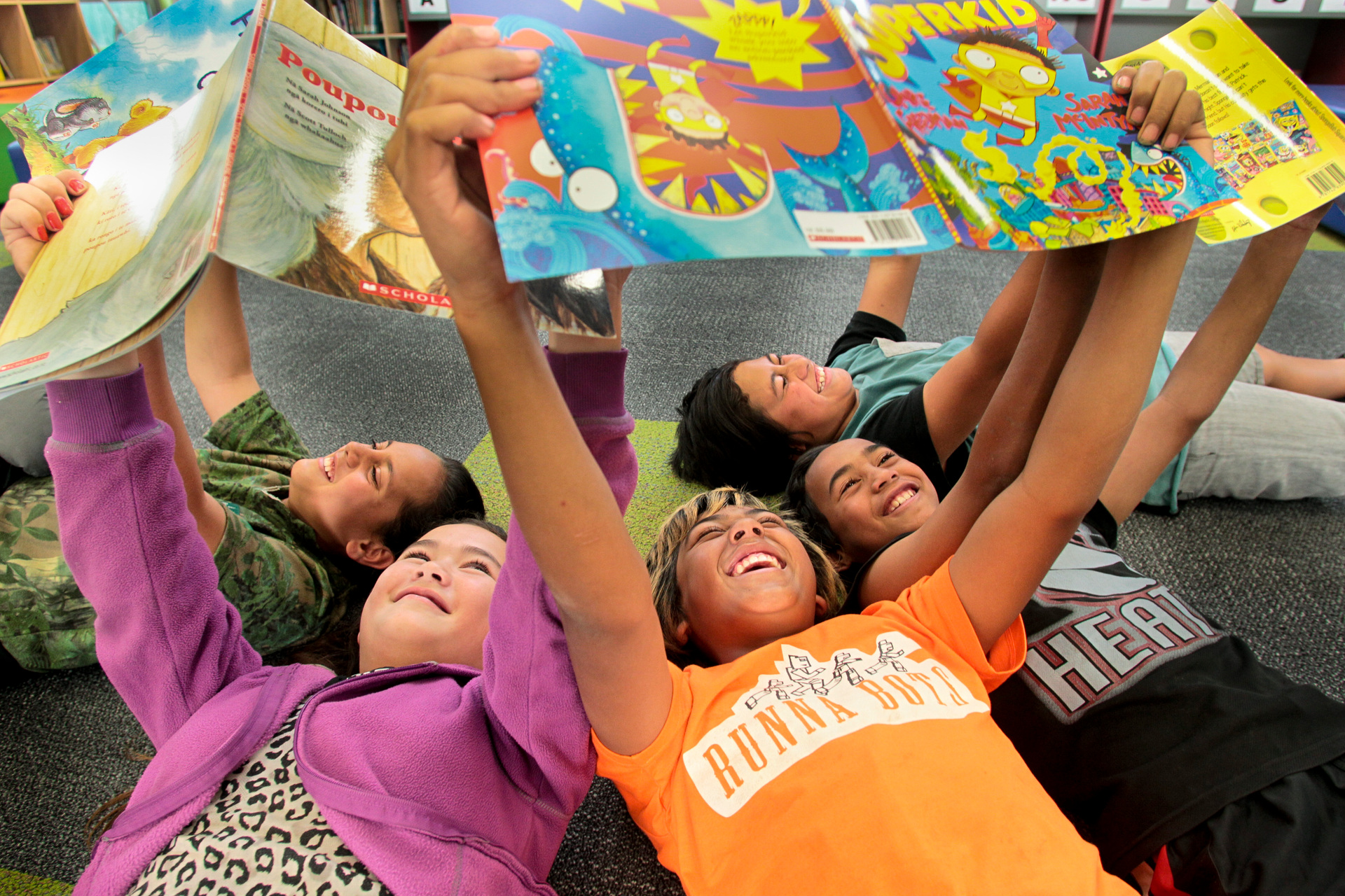 Children from Camberley School in Hastings bask in the exciting glow of the power of books. Photo / Warren Buckland, File