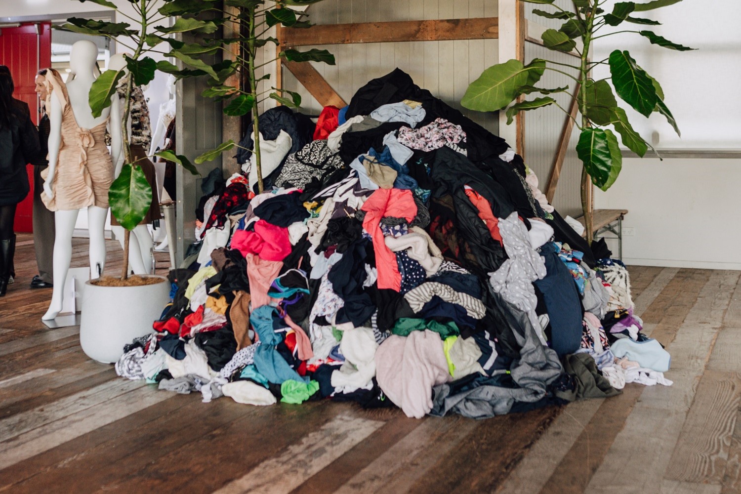 A pile of garments representing the volume of textile waste in New Zealand, on display at the Circular Fashion Awards 2024. Photo / Radlab