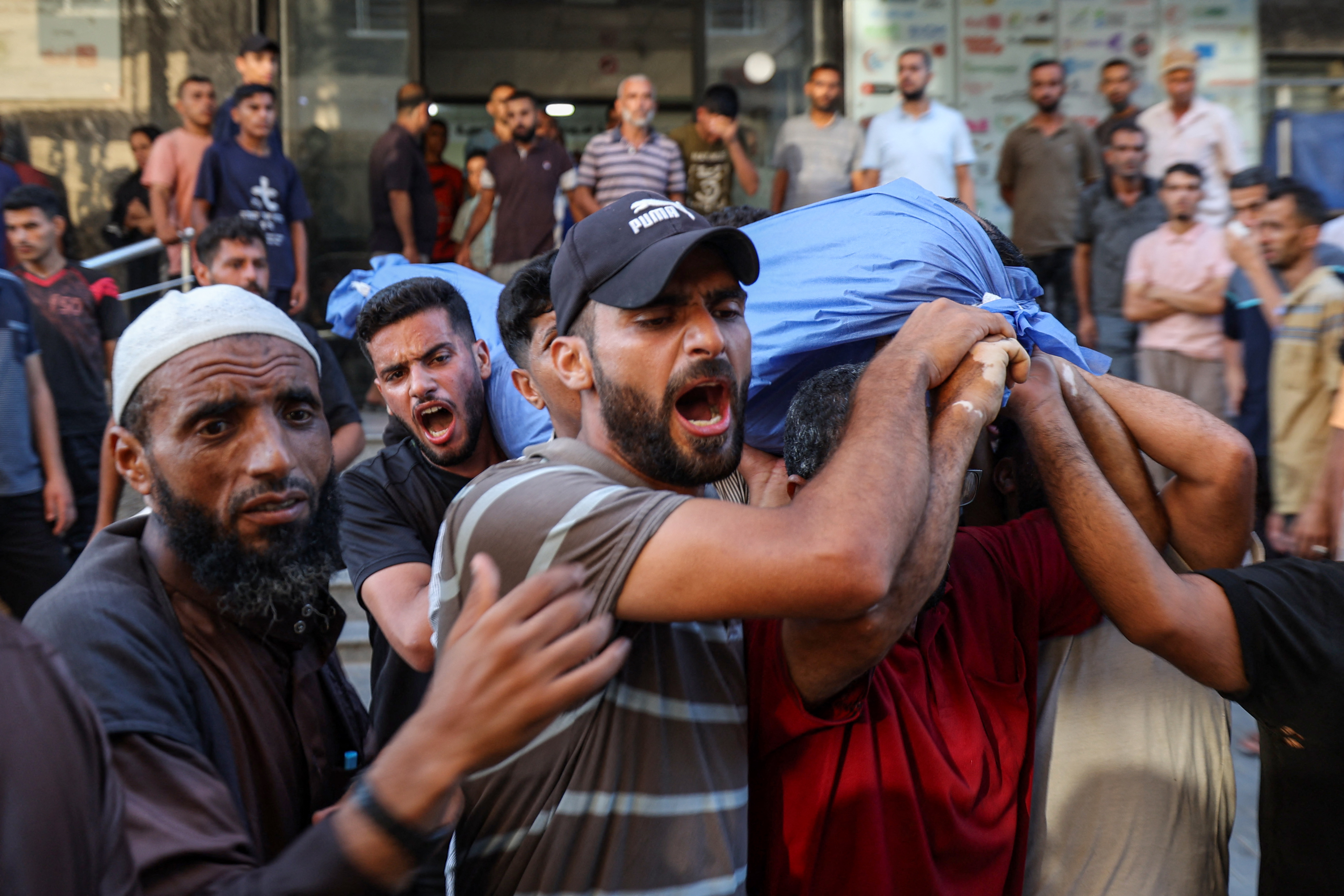 People carry the bodies of victims who were killed by Israeli bombardment outside Al-Awda Hospital in the Nuseirat camp for Palestinian refugees in the central Gaza Strip on July 16, 2025. Photo / Eyad Baba, AFP