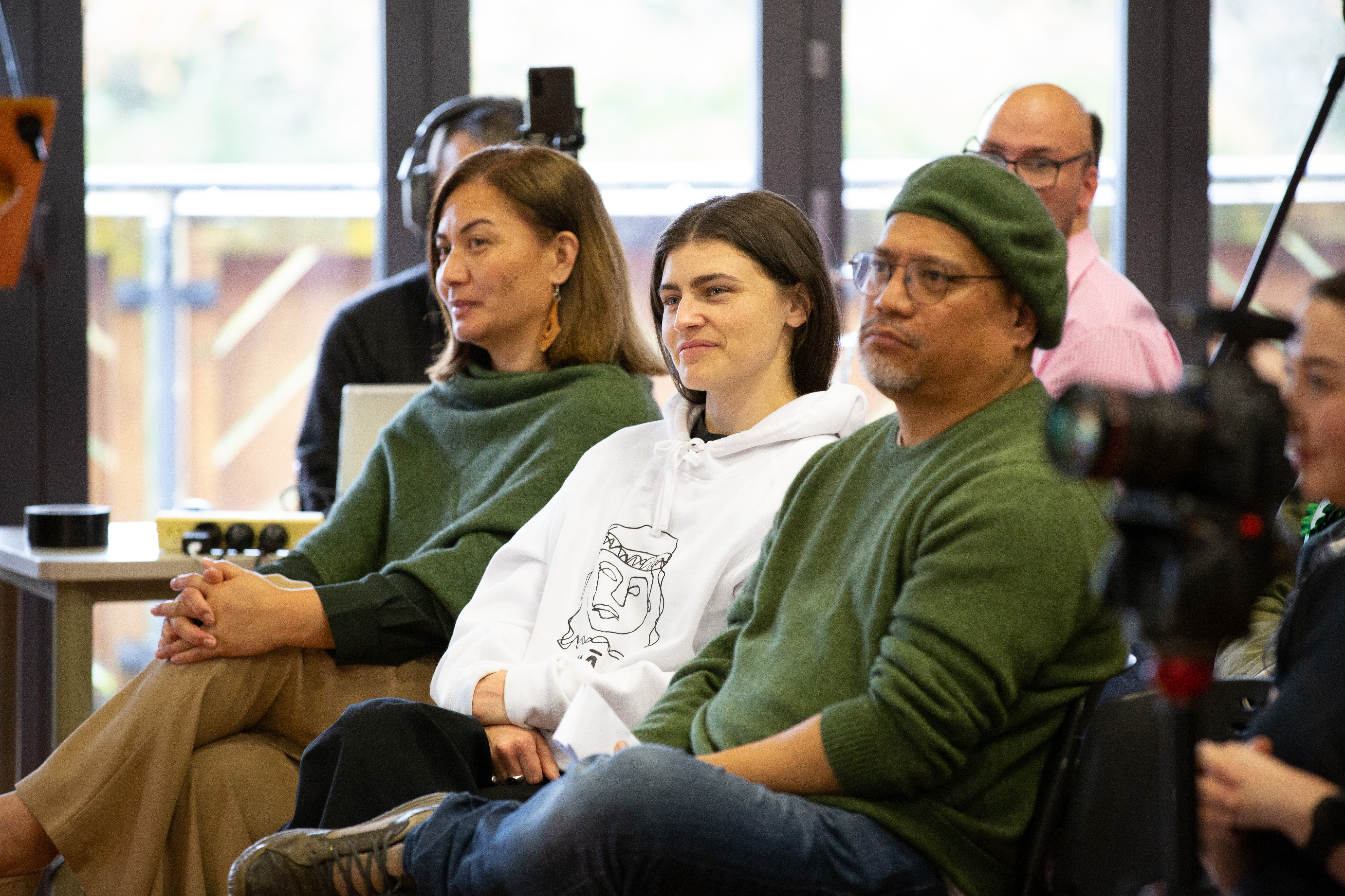 Green co-leader Marama Davidson, and MPs Chloe Swarbrick and Teanau Tuiono listen to co-leader James Shaw speak at the party AGM in Auckland. Photo / Sylvie Whinray
