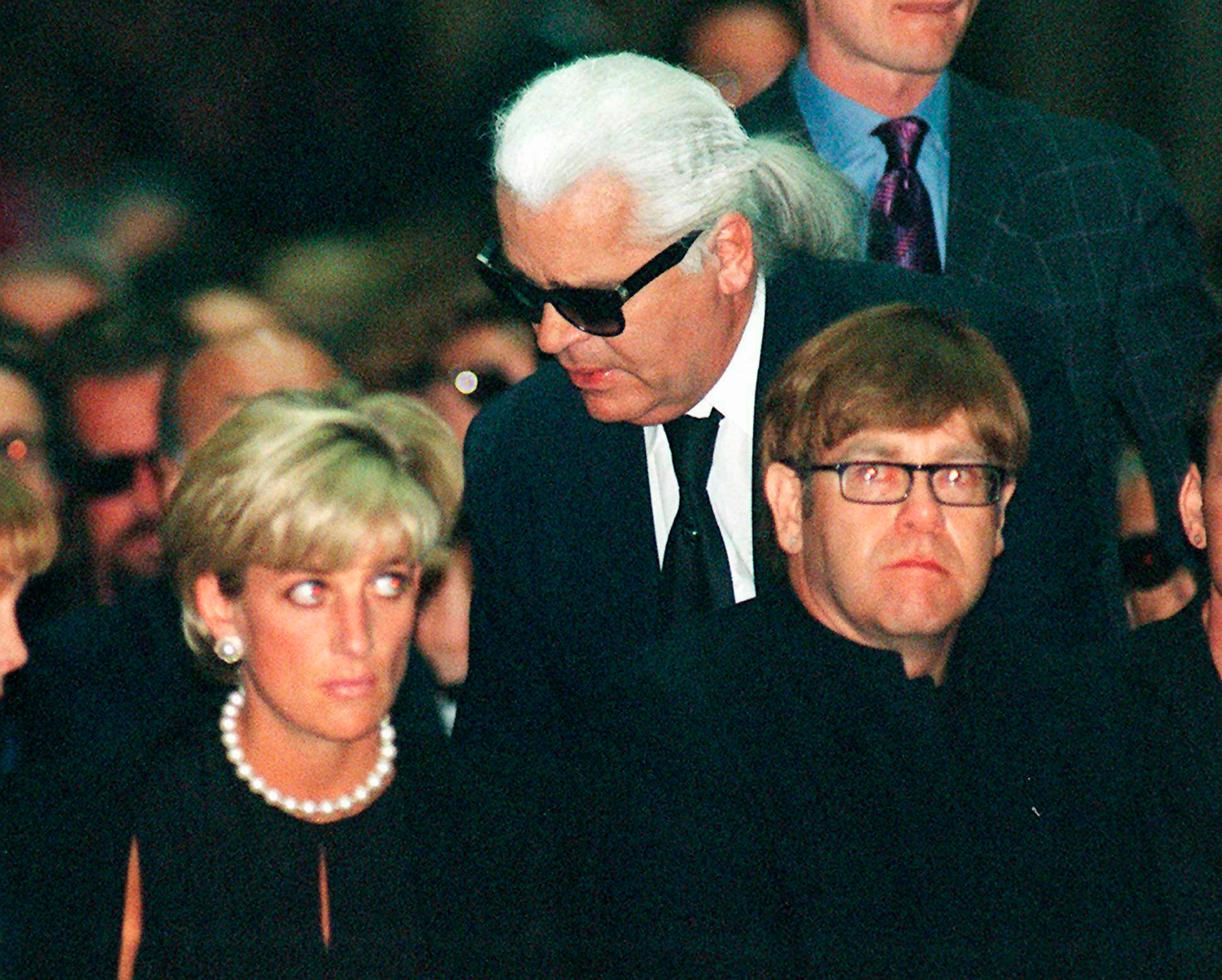 Diana, Princess of Wales, German fashion designer Karl Lagerfeld and British pop-star Elton John, attend the memorial mass for Gianni Versace on July 22, 1997. Photo / AP