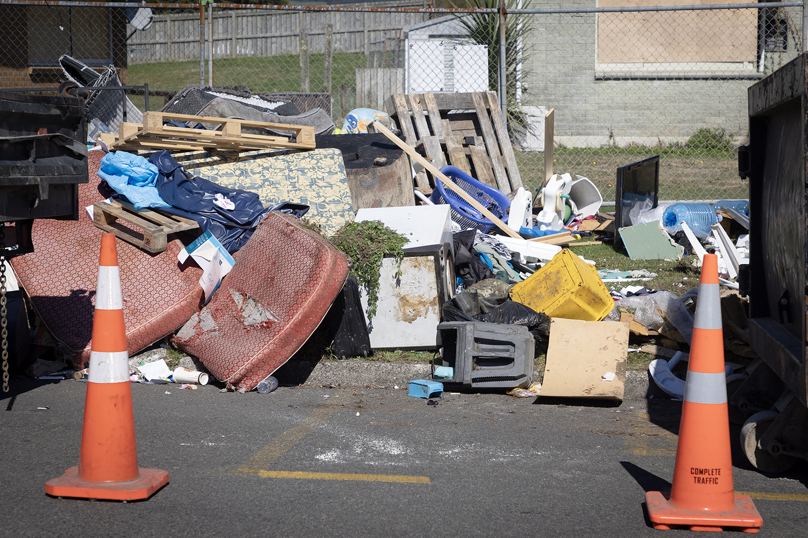 Piles of rubbish being removed from the roadside on Wrigley Rd. Photo / Andrew Warner