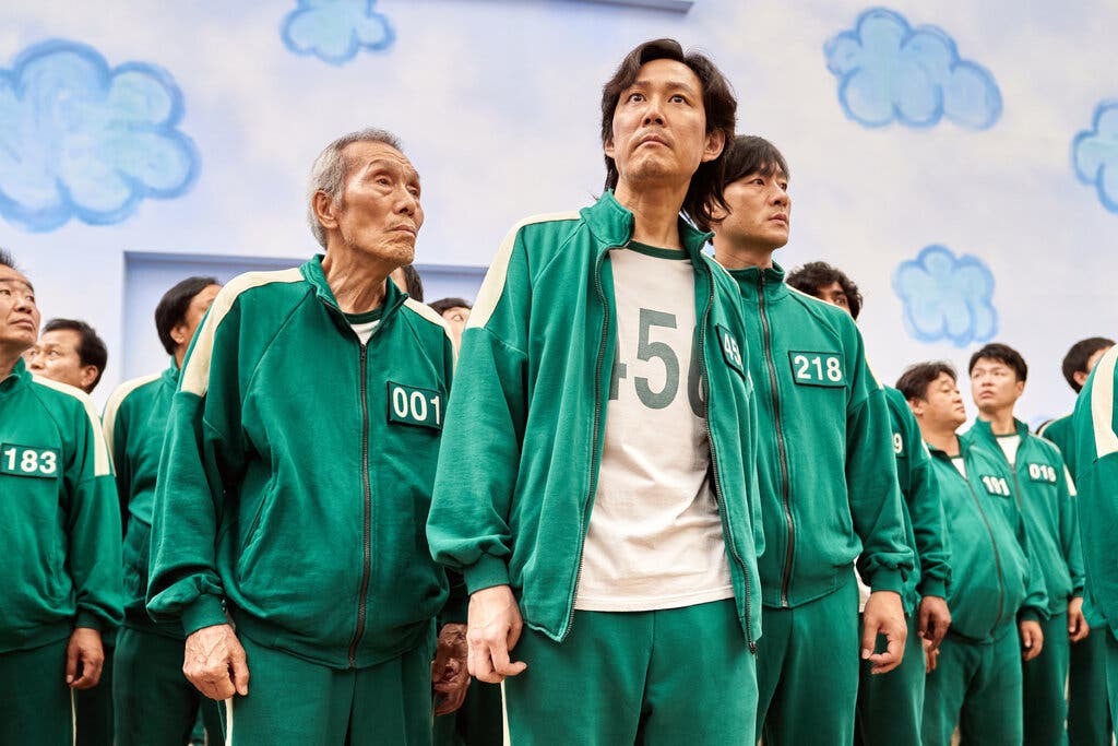 Oh Yeong-su, left, with Lee Jung-jae, centre, and Park Hae-soo, star in the popular Squid Game. Photo / Netflix
