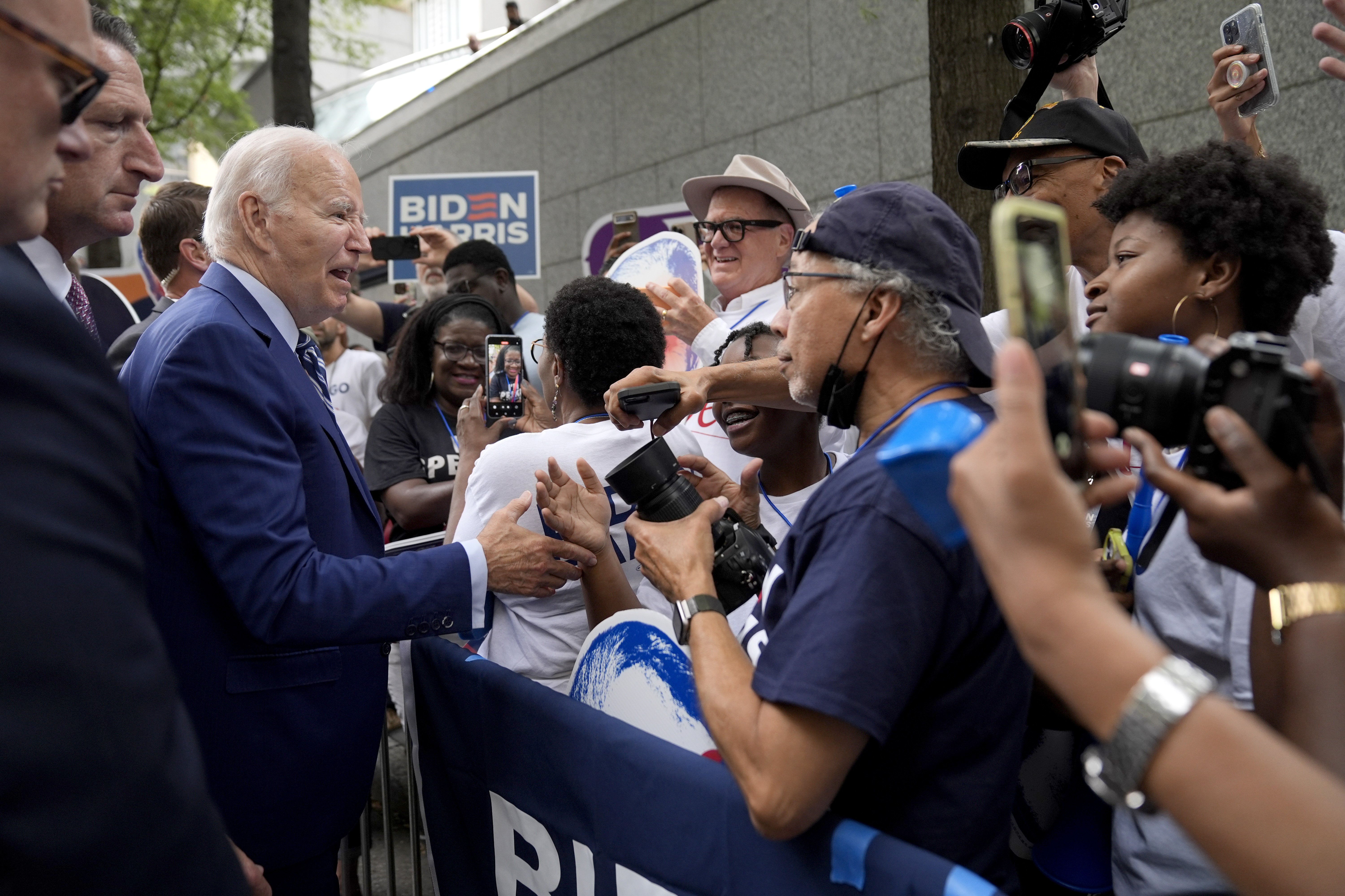President Joe Biden, left, greets supporters in Atlanta, Georgia, before a presidential debate. Photo / AP