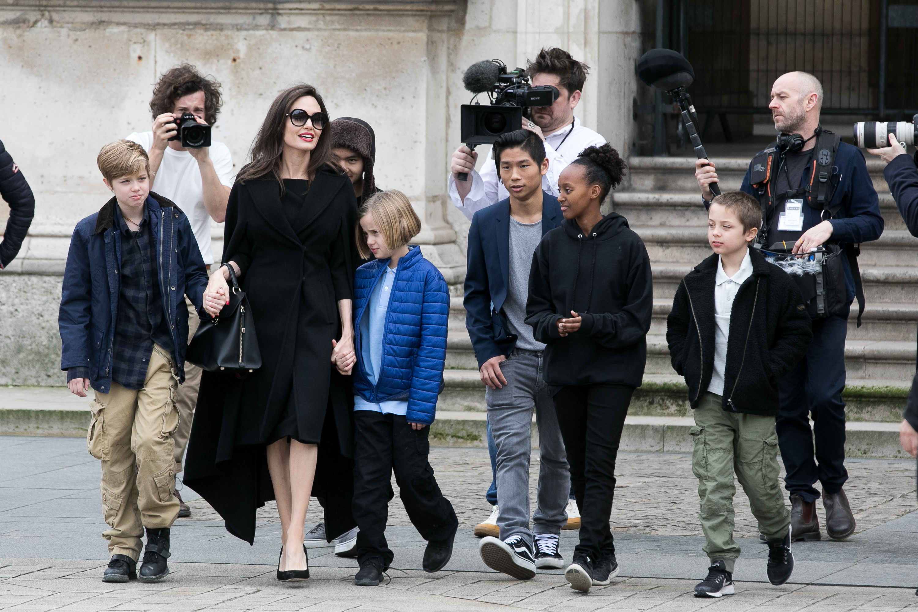Angelina Jolie and her children Maddox, Shiloh, Vivienne, Knox, Zahara and Pax leaving the Louvre museum in 2018 in Paris, France. Photo / Getty Images