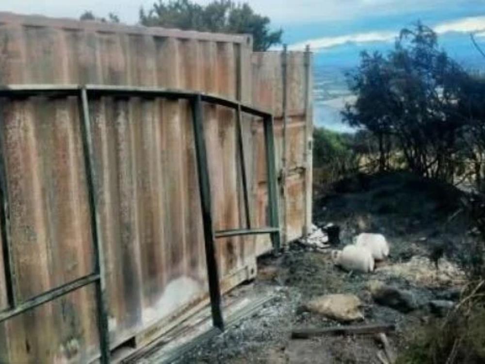 The container after the fire ripped through the property. 