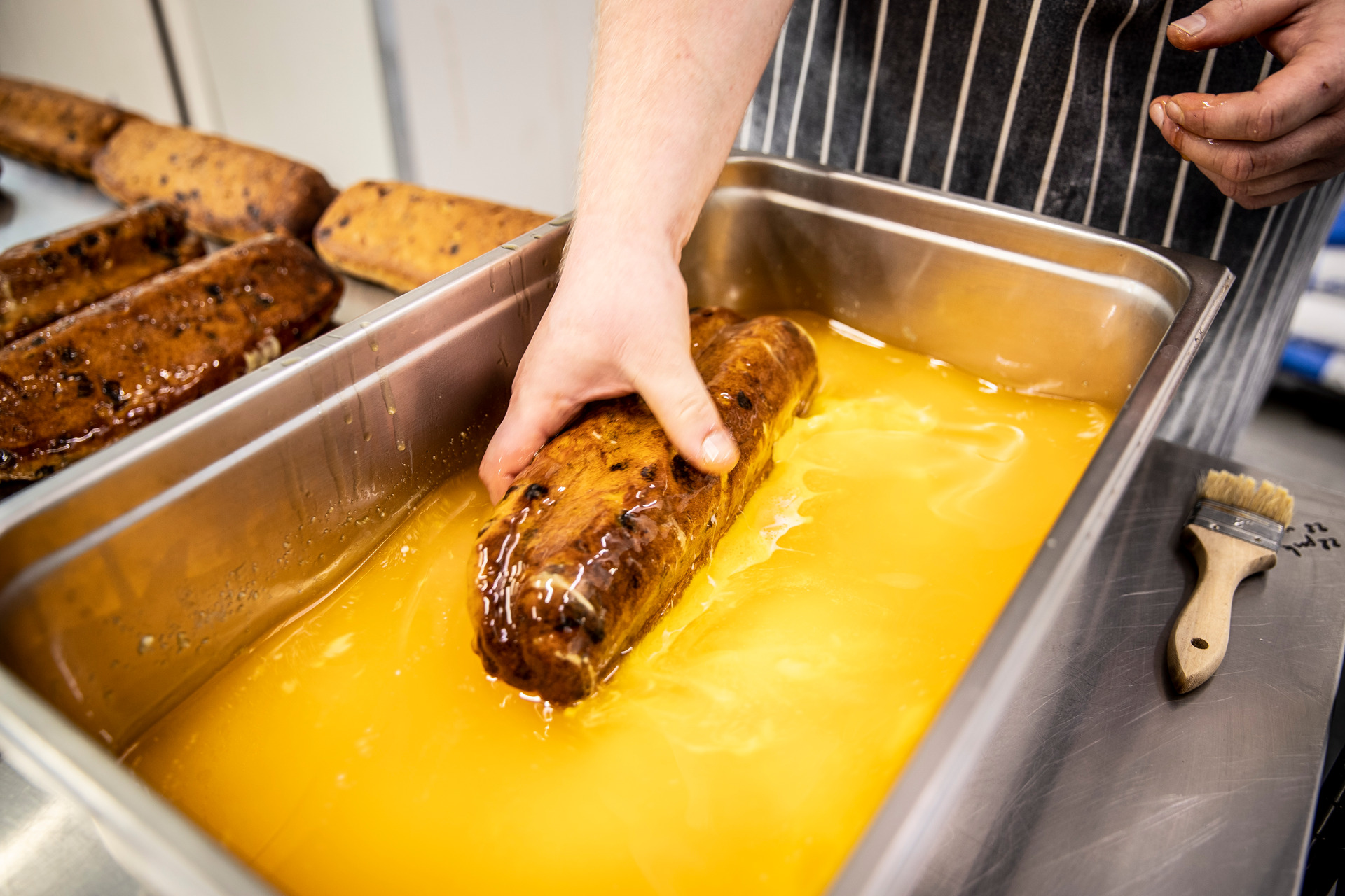 First, melt your butter. Patrick Welzenbach, Daily Bread co-owner, makes Christmas stollen according to the recipe perfected by his German grandfather. Photo/Michael Craig