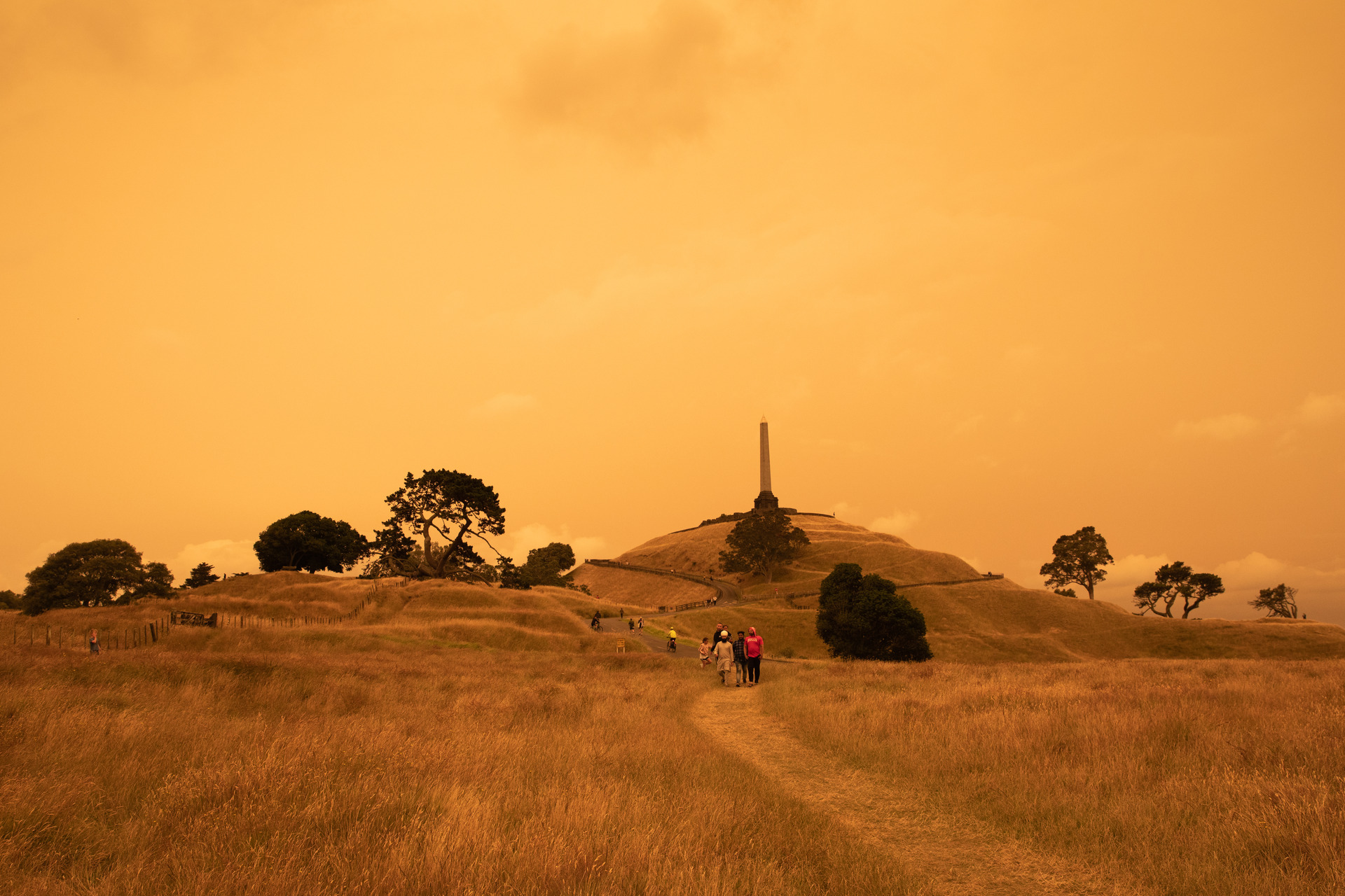Auckland's One Tree Hill, as it appeared on January 5 last year: back-dropped by an orange sky caused by smoke from the Australian bush fires. Photo / Greg Bowker Visuals