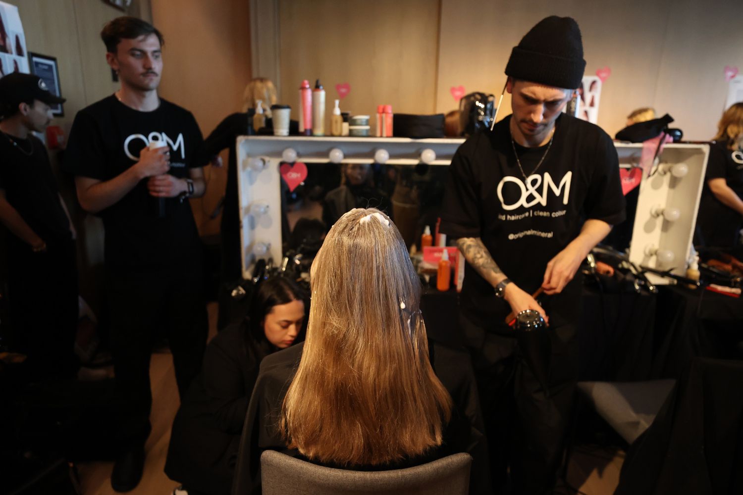 Volumising mousse sets in a model’s hair backstage at Zambesi. Photo / Getty Images