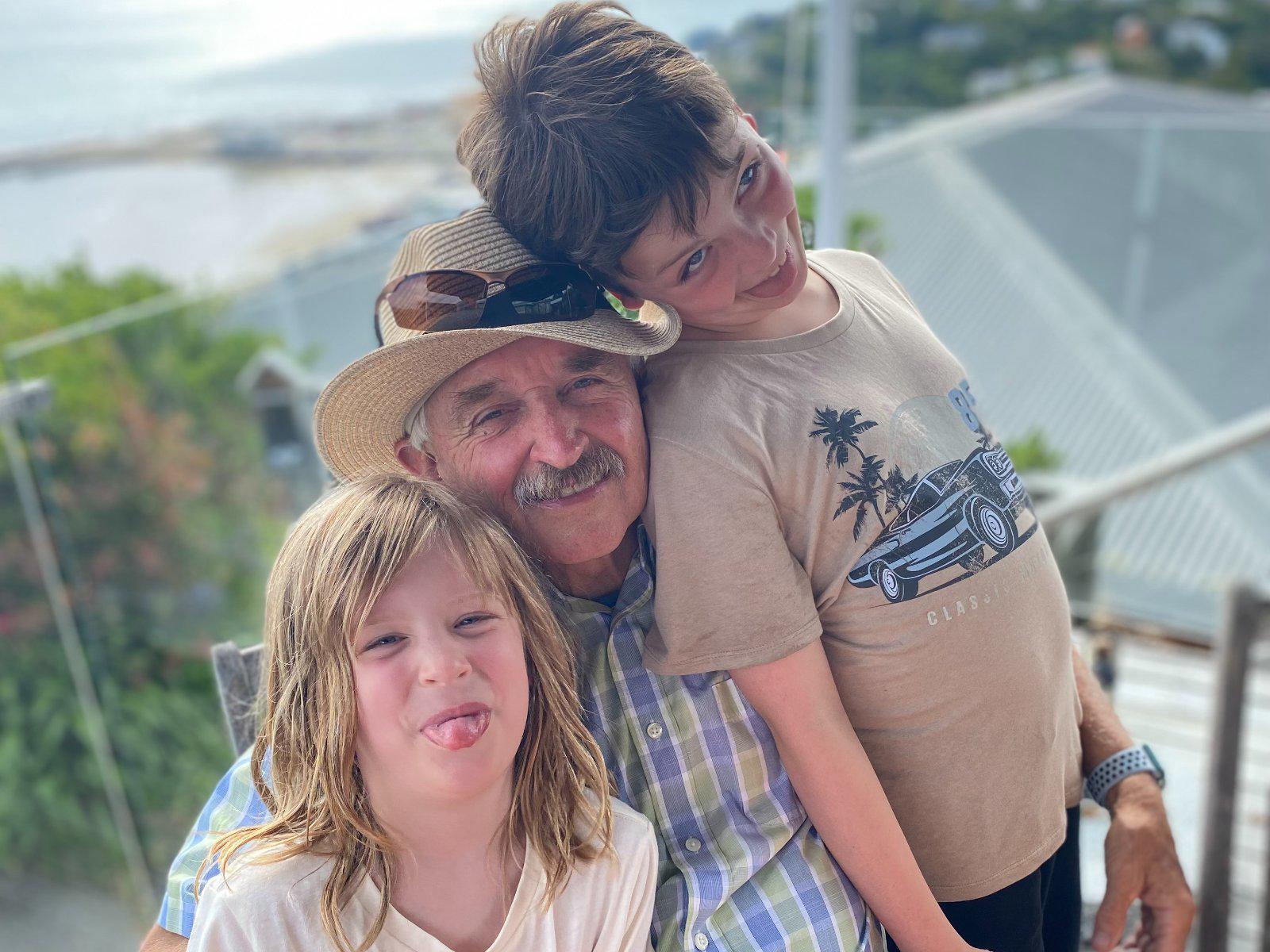 Retired GP Logan McLennan has multiple myeloma, a type of blood cancer, and needs drugs that are not funded by Pharmac. Photographed on Christmas Day 2023, with his grandchildren Neve and Arlo Oxley.