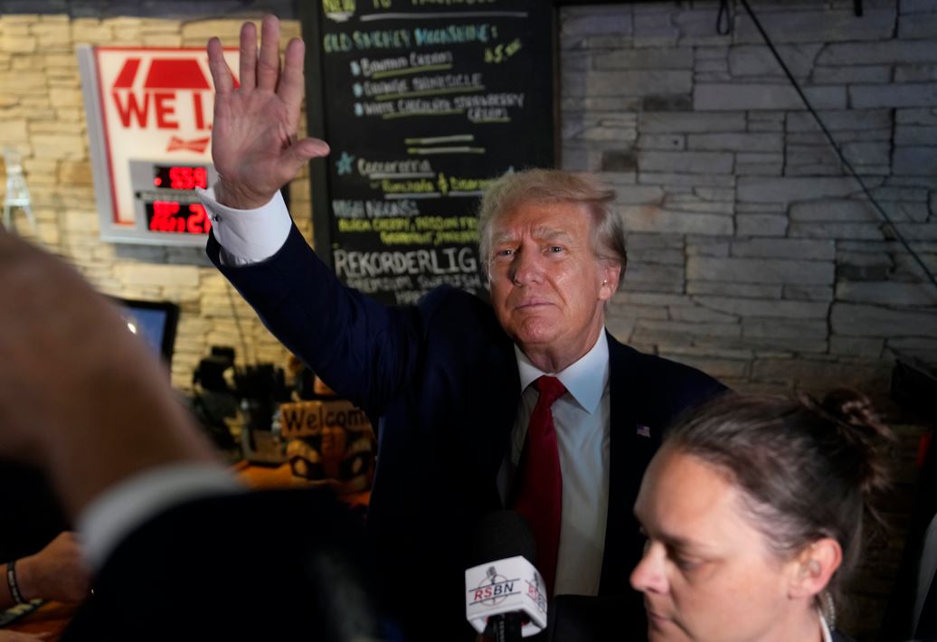 Former President Donald Trump greets supporters at the Treehouse Pub & Eatery. Photo / AP