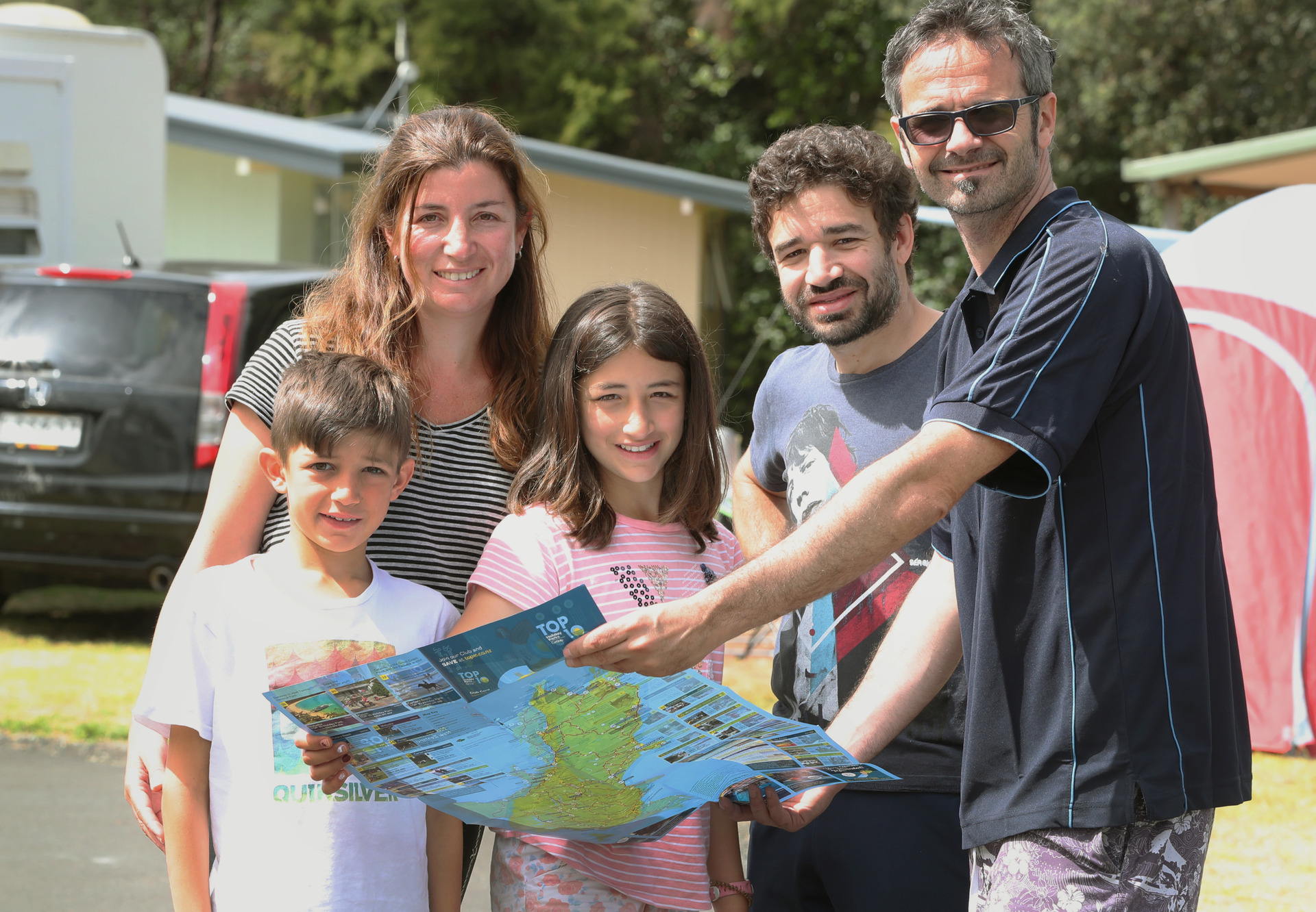 From left, Gino Calla Moret, Ruth Moret, Maite Calla Moret, Jaime Calla and campground owner Nick Blake at the Whangārei Top 10 Holiday Park. Photo / John Stone