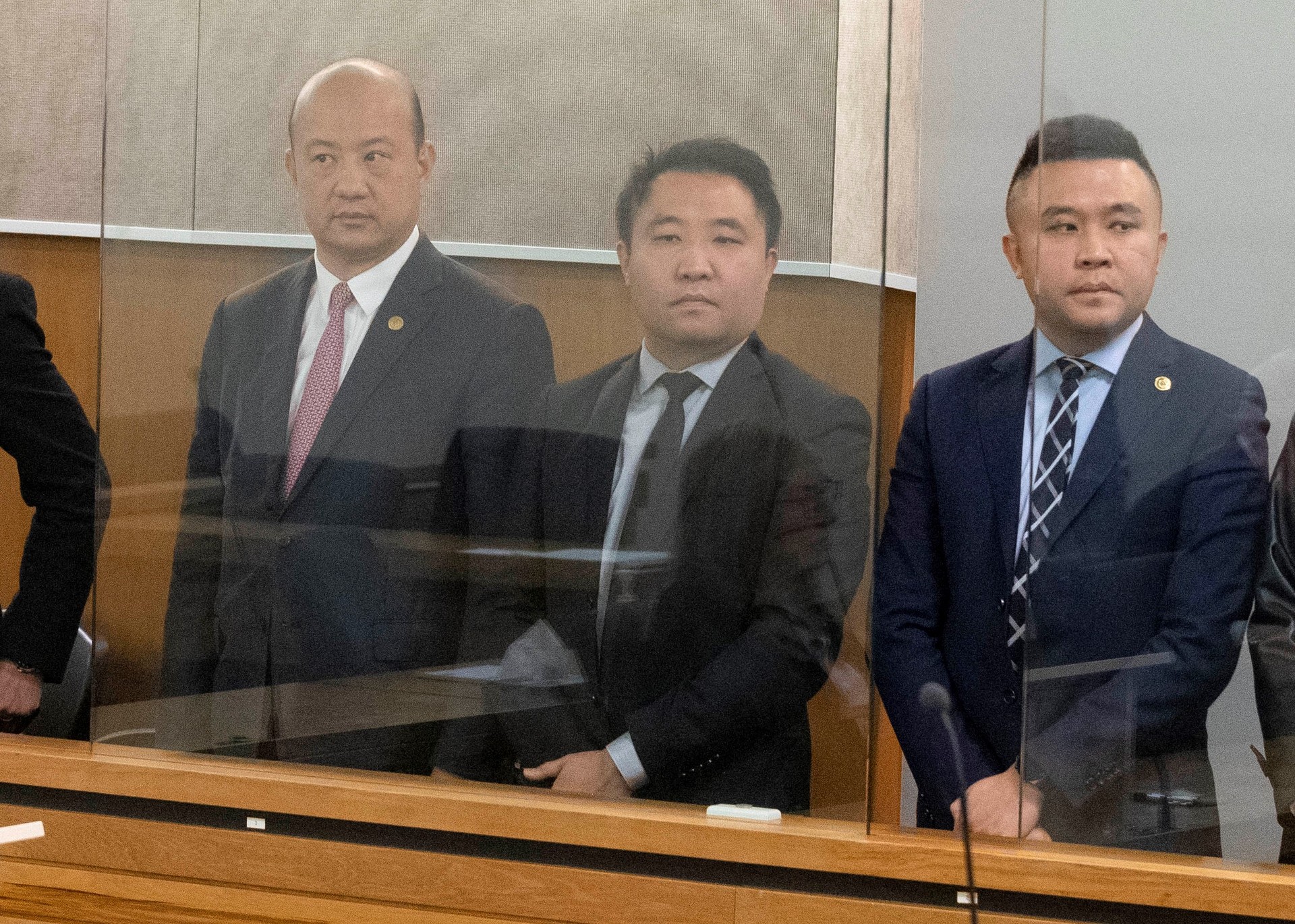 Businessmen Yikun Zhang, Hengjia (Joe) Zheng and Shijia (Colin) Zheng at their first court appearance in the Labour Party donations case. Photo / Jason Oxenham