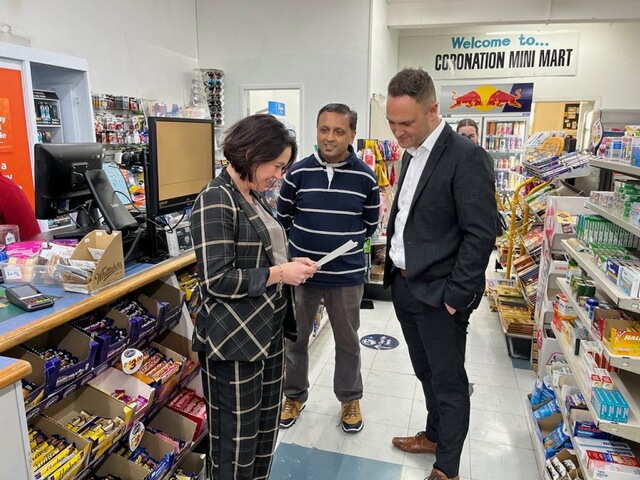 Police Minister Ginny Andersen and Northcote MP Shanan Halbert pay a visit to an Auckland dairy ram raided four times in recent months. 