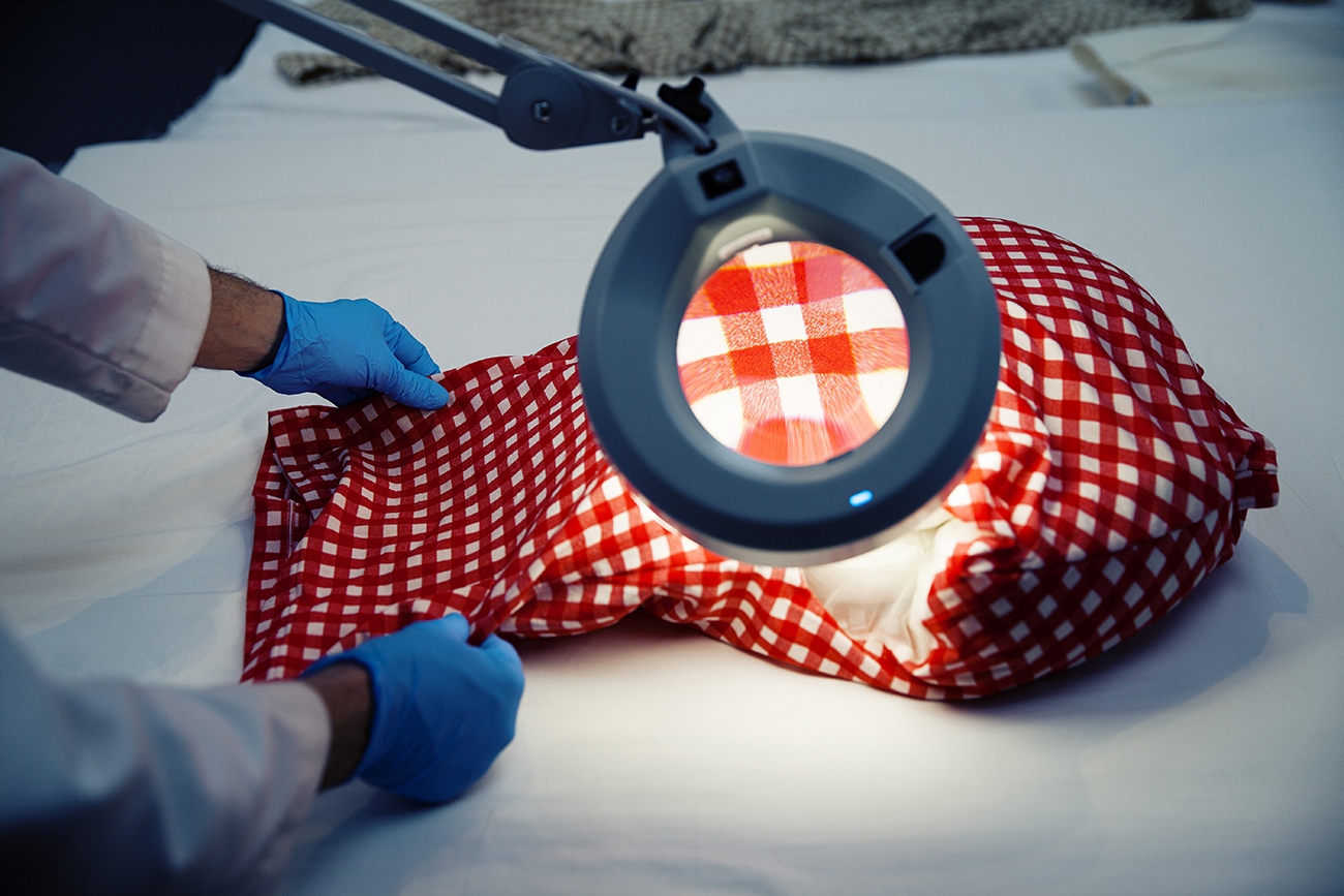 Conservators inspect a Comme des Garçons garment for damage at the Costume Institute. Picture / The Washington Post by Jesse Dittmar
