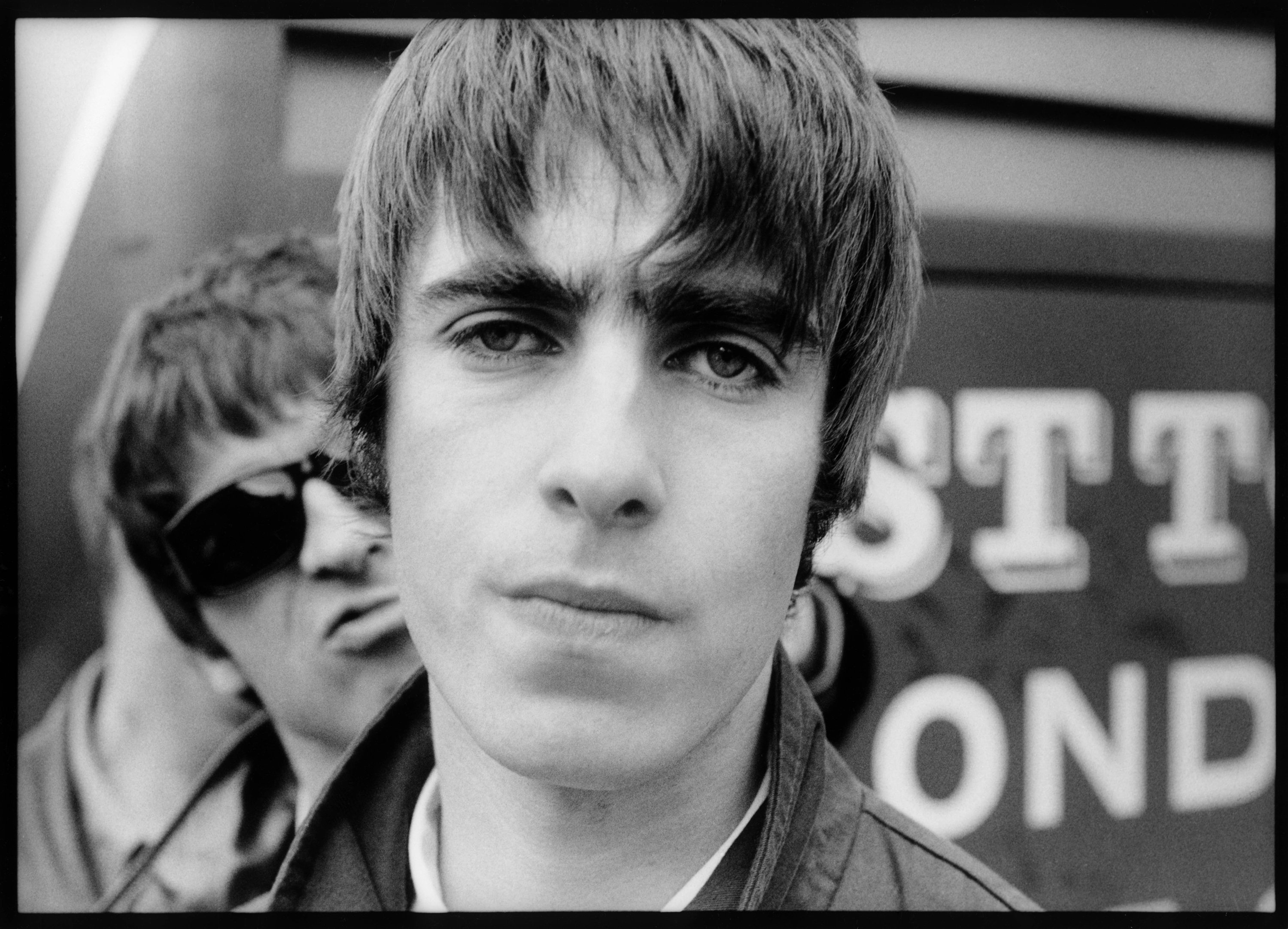 Liam Gallagher with Noel Gallagher. Photo by Michel Linssen/Redferns