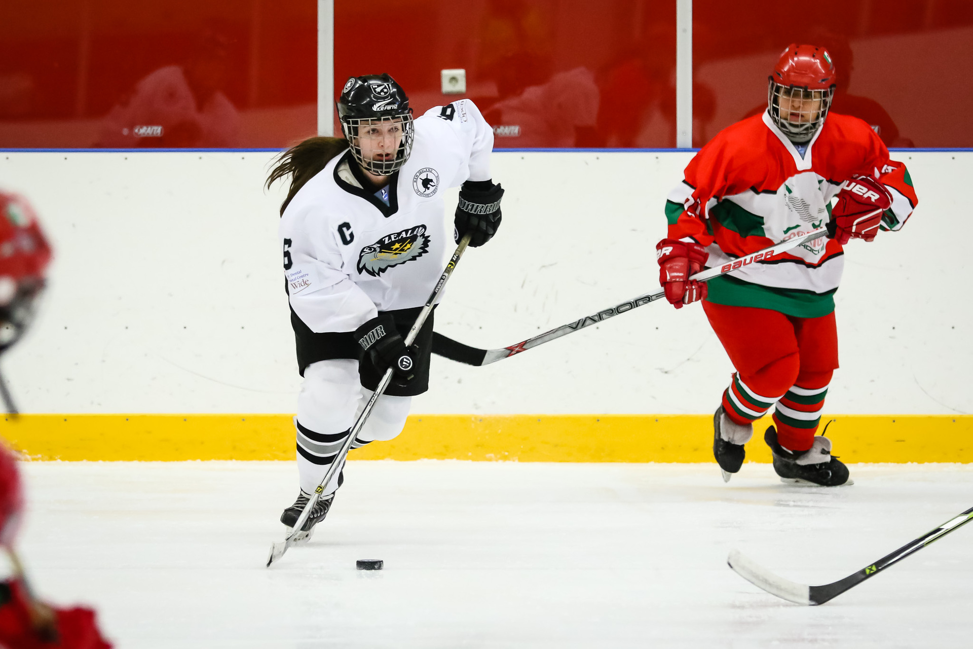 Murray, left, in action as captain of the Ice Fernz at the 2020 Women's Ice Hockey World Championships in Iceland, where the team won a bronze medal in division two. Photo / Supplied