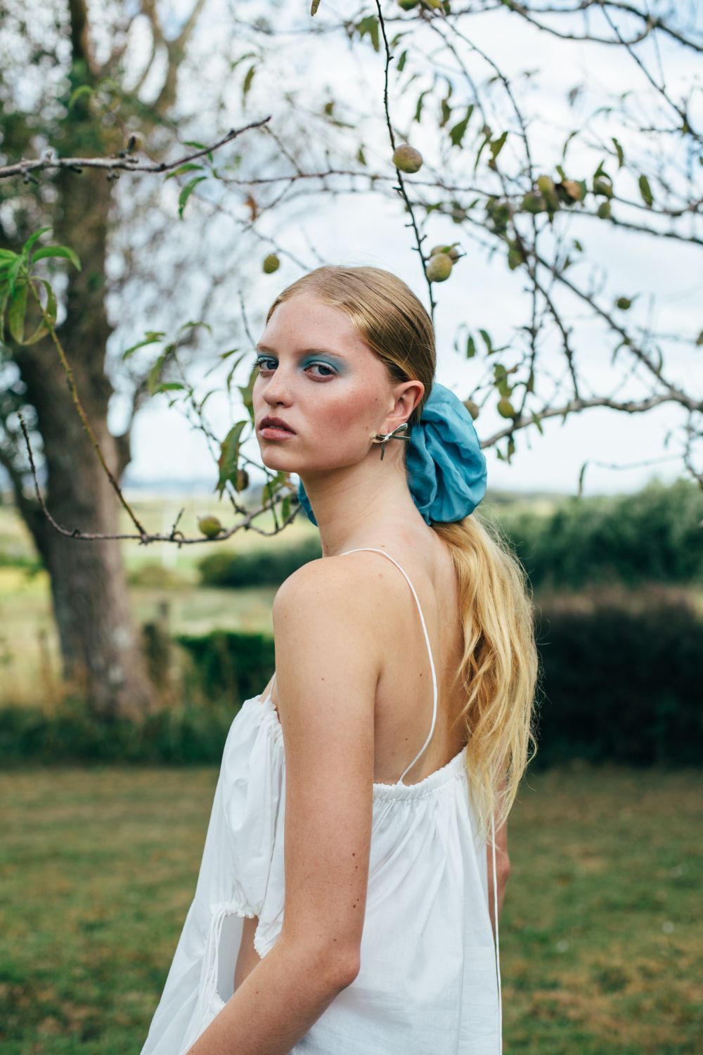 Rory Williams Docherty dress. Gloria silk scrunchie. Meadowlark earrings. Photo / Anahita Paul