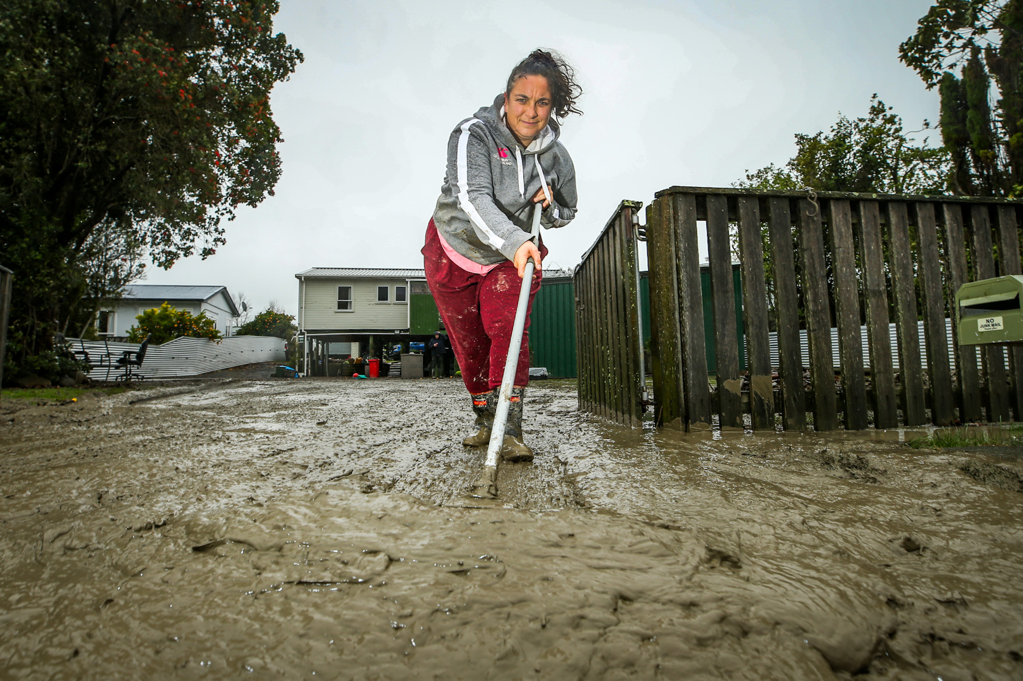 Wairoa resident Libby Young cleaning up her flooded property on Thursday. Photo / Paul Taylor