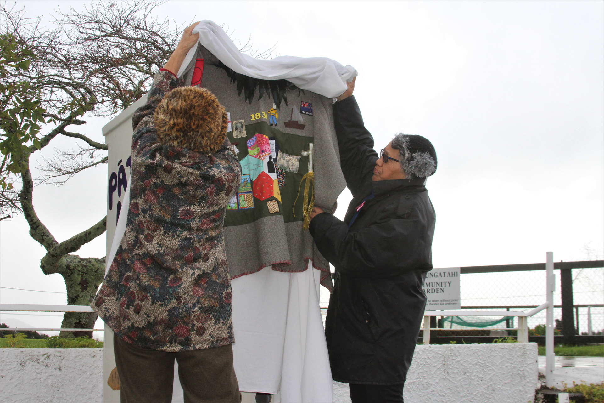 Te Awamutu Māori Women's Welfare League vice-chairwoman, Ada Te Huia (left) and the group's treasurer, Raylee Price, remove the korowai from the Pātaka Kai. Photo / Caitlan Johnston