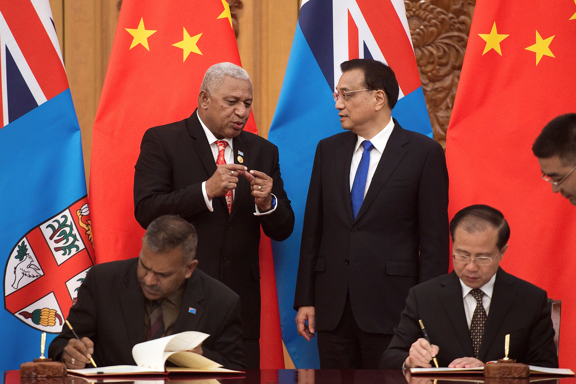 Fiji's Prime Minister Prime Minister Frank Bainimarama (top left) talks with Chinese Premier Li Keqiang in 2017. Photo / AP