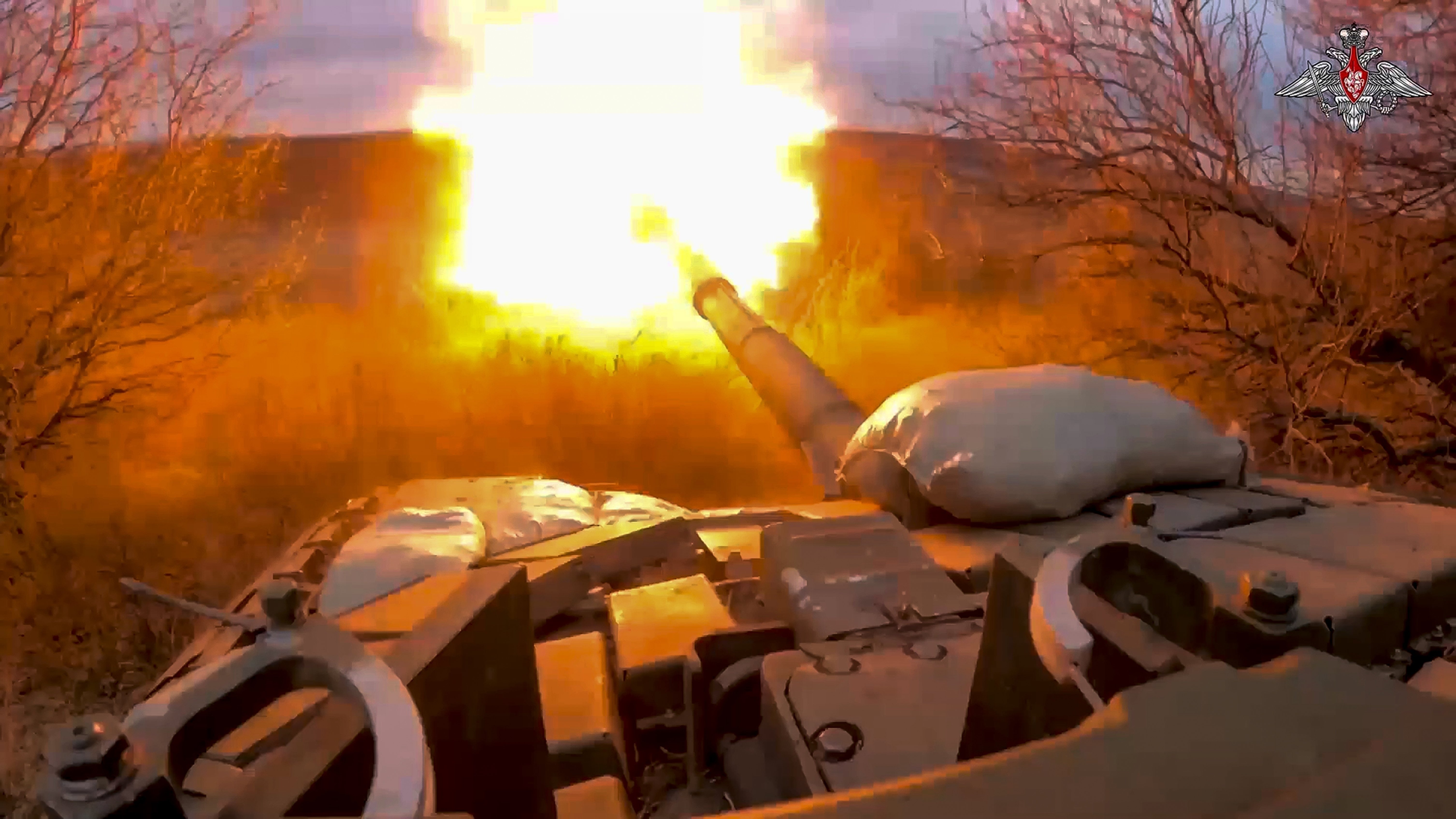A Russian tank fires at Ukrainian troops from a position near the border with Ukraine in Russia’s Belgorod region. Photo / Russian Defense Ministry Press Service via AP